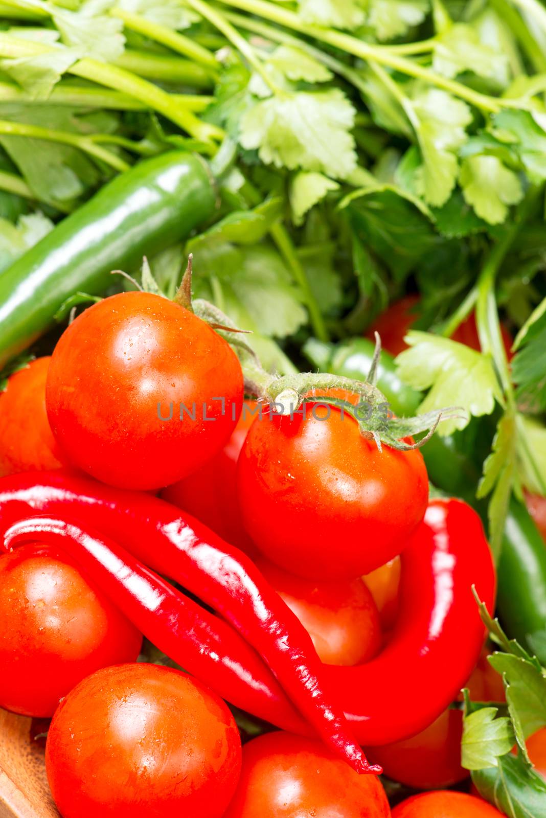 Tomato and red hot chili peppers close up by Nanisimova