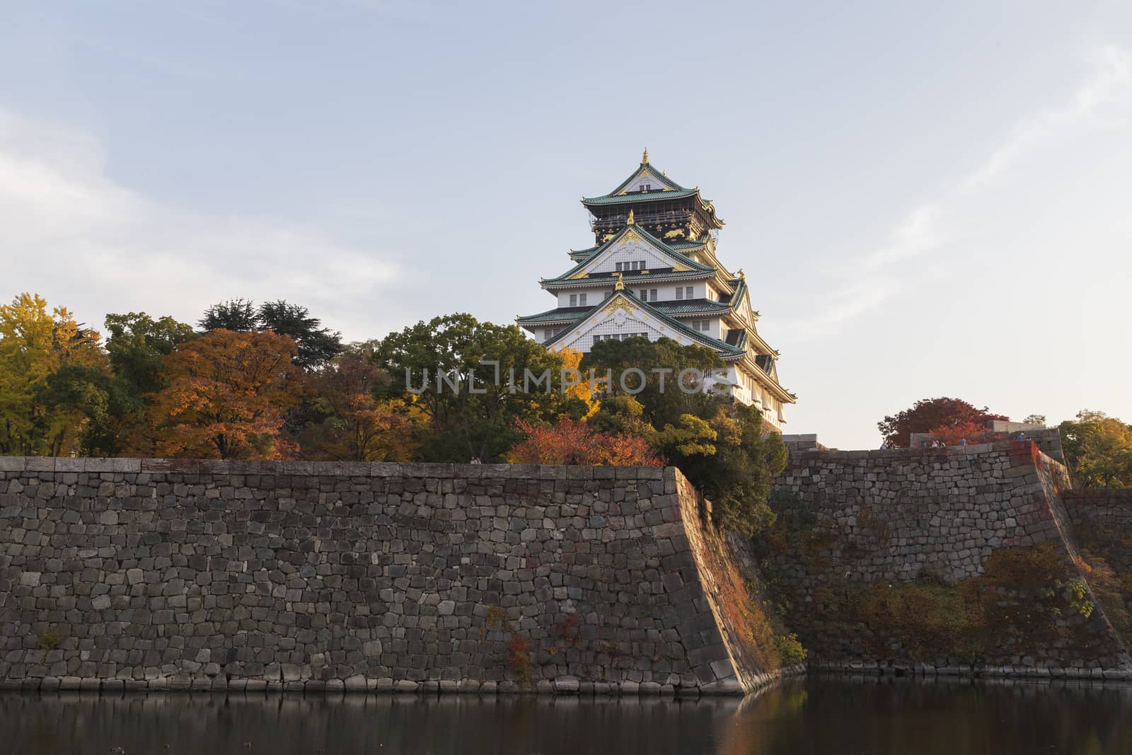 This photo was shot from Osaka Castle, Japan in the evening. The soft sunlight touch the castle is so beautiful.