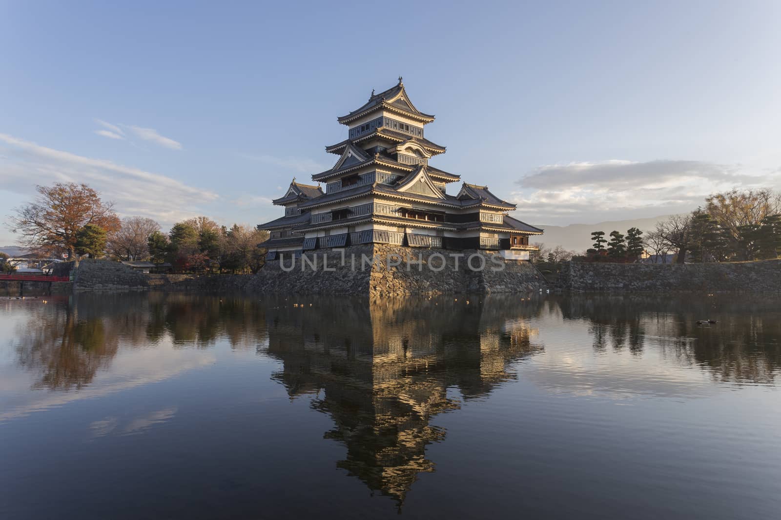 This photo was shot from Matsumoto Castle, Japan in early morning. The soft sunlight touch the castle is so beautiful.