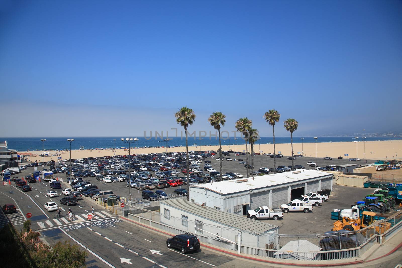 Beach goers and parking near the famous Santa Monica Pier.