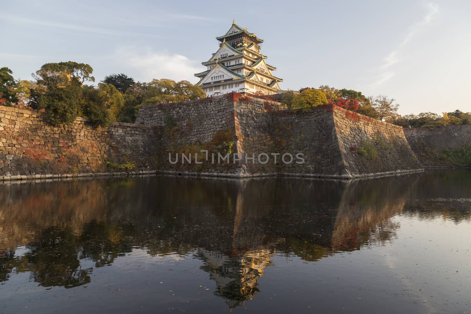 This photo was shot from Osaka Castle, Japan in the evening. The soft sunlight touch the castle is so beautiful.