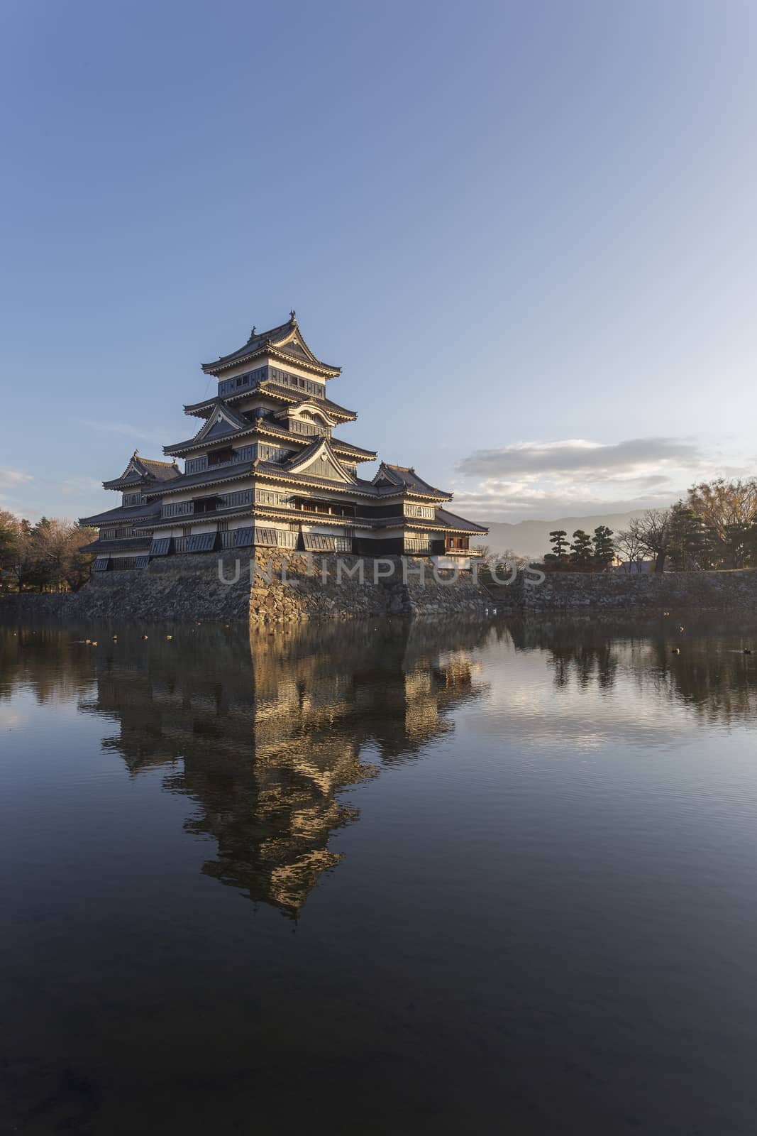 This photo was shot from Matsumoto Castle, Japan in early morning. The soft sunlight touch the castle is so beautiful.