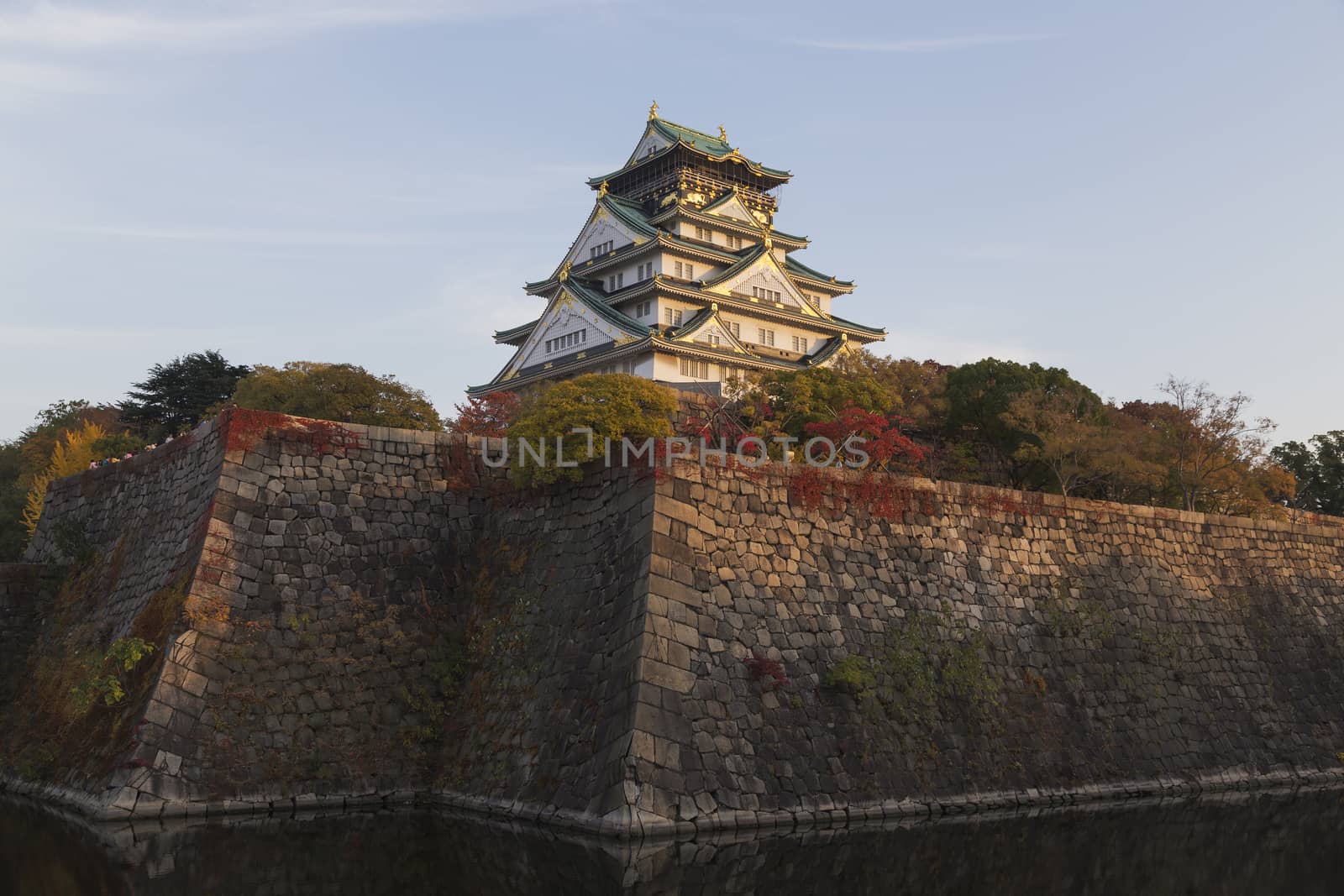 This photo was shot from Osaka Castle, Japan in the evening. The soft sunlight touch the castle is so beautiful. 