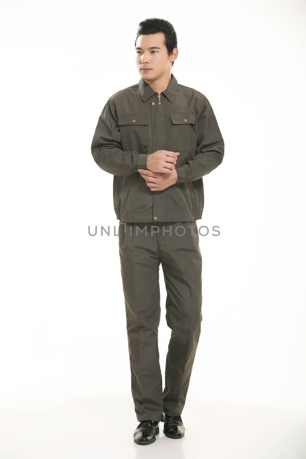 The young engineer various occupation clothing standing in front of a white background