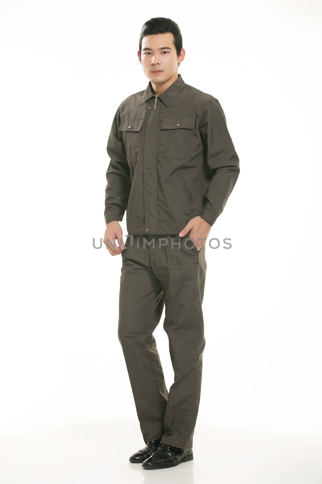 The young engineer various occupation clothing standing in front of a white background