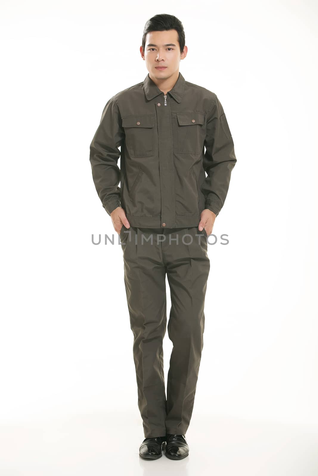 The young engineer various occupation clothing standing in front of a white background