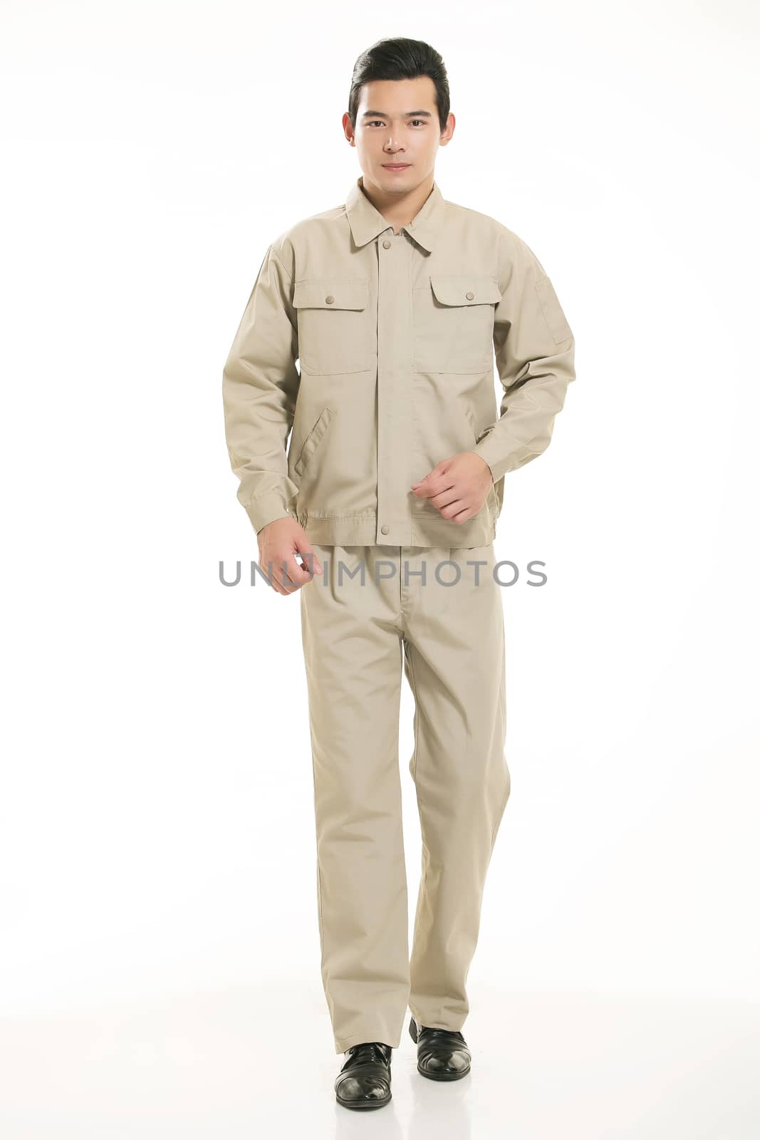 The young engineer various occupation clothing standing in front of a white background