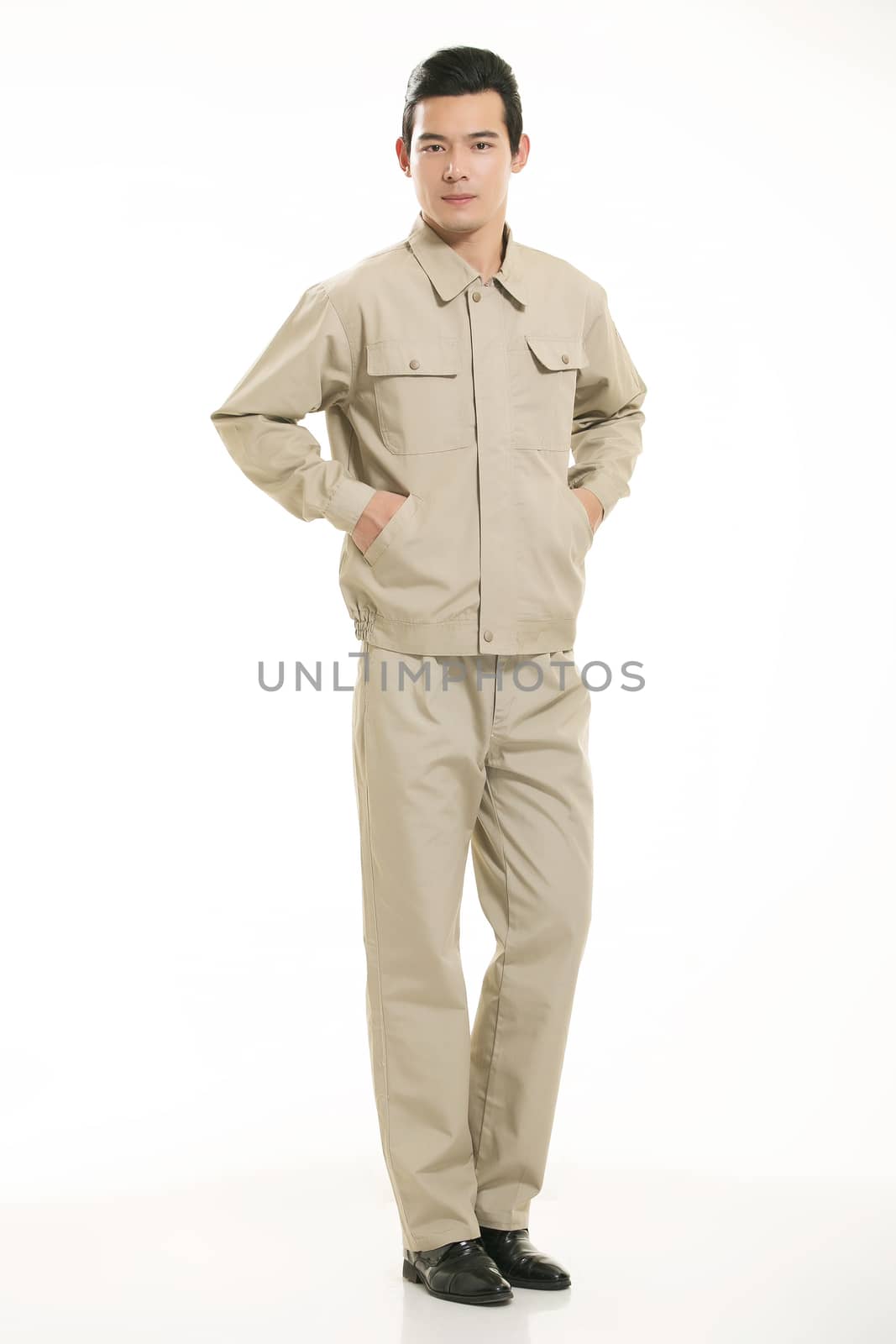 The young engineer various occupation clothing standing in front of a white background