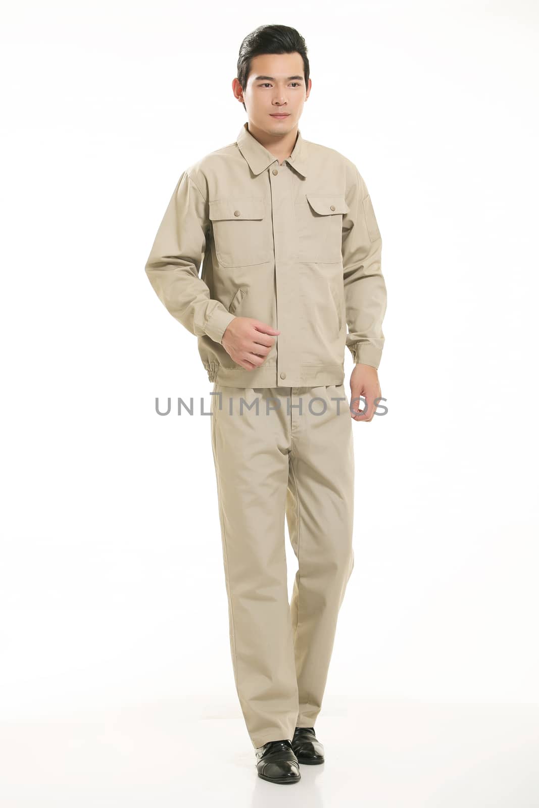 The young engineer various occupation clothing standing in front of a white background