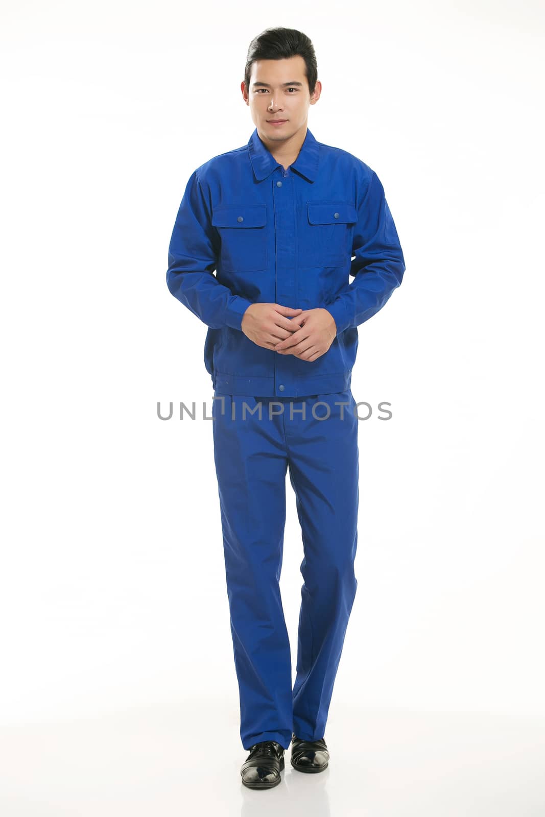 The young engineer various occupation clothing standing in front of a white background