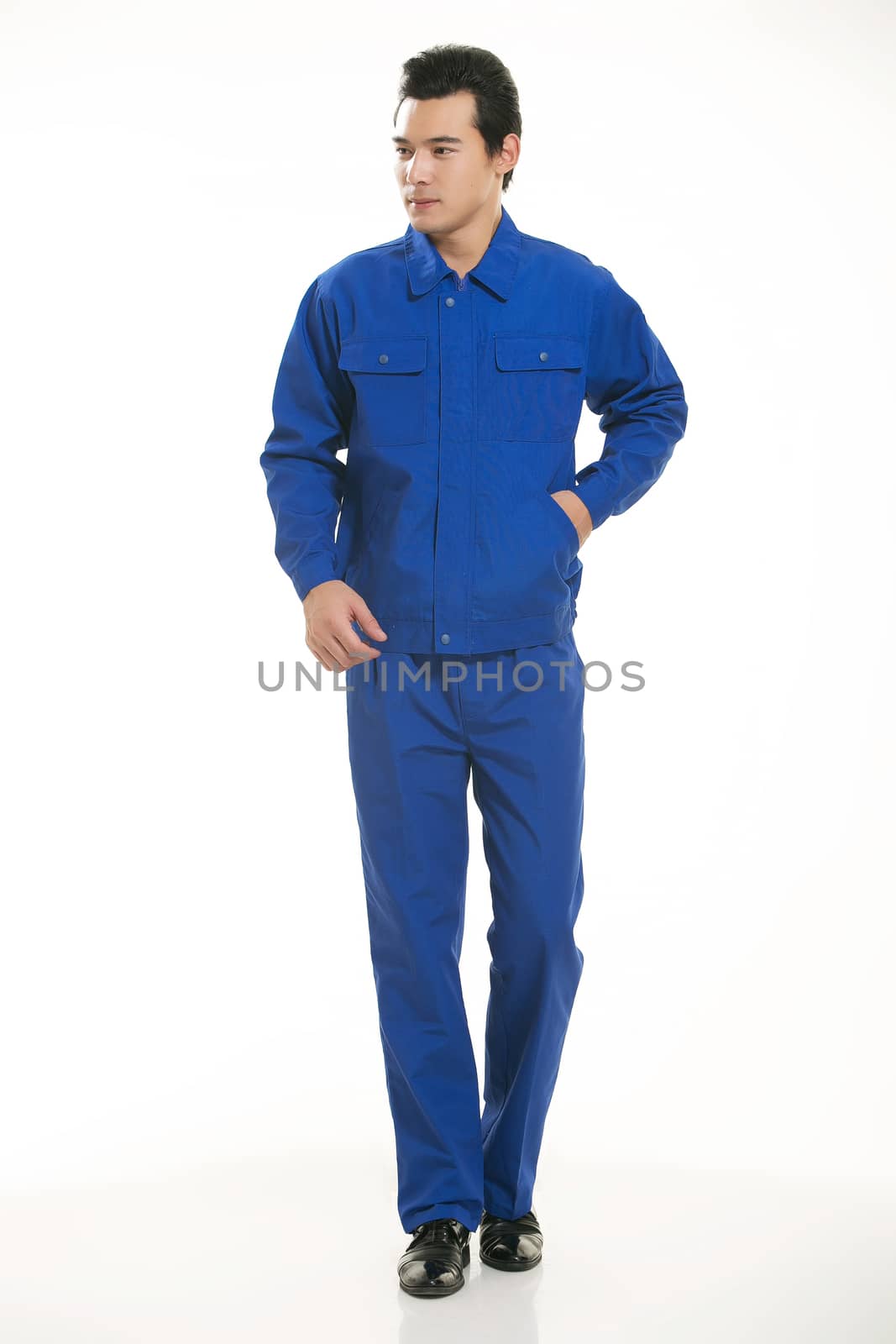 The young engineer various occupation clothing standing in front of a white background