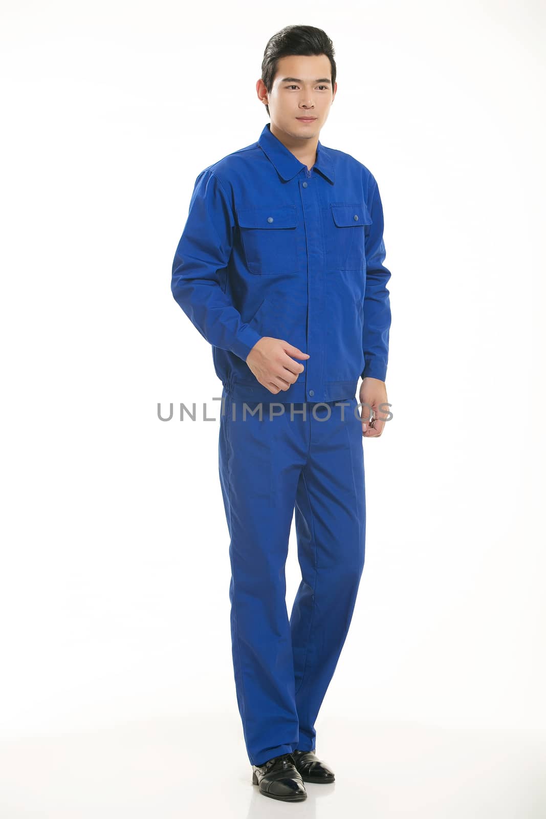 The young engineer various occupation clothing standing in front of a white background