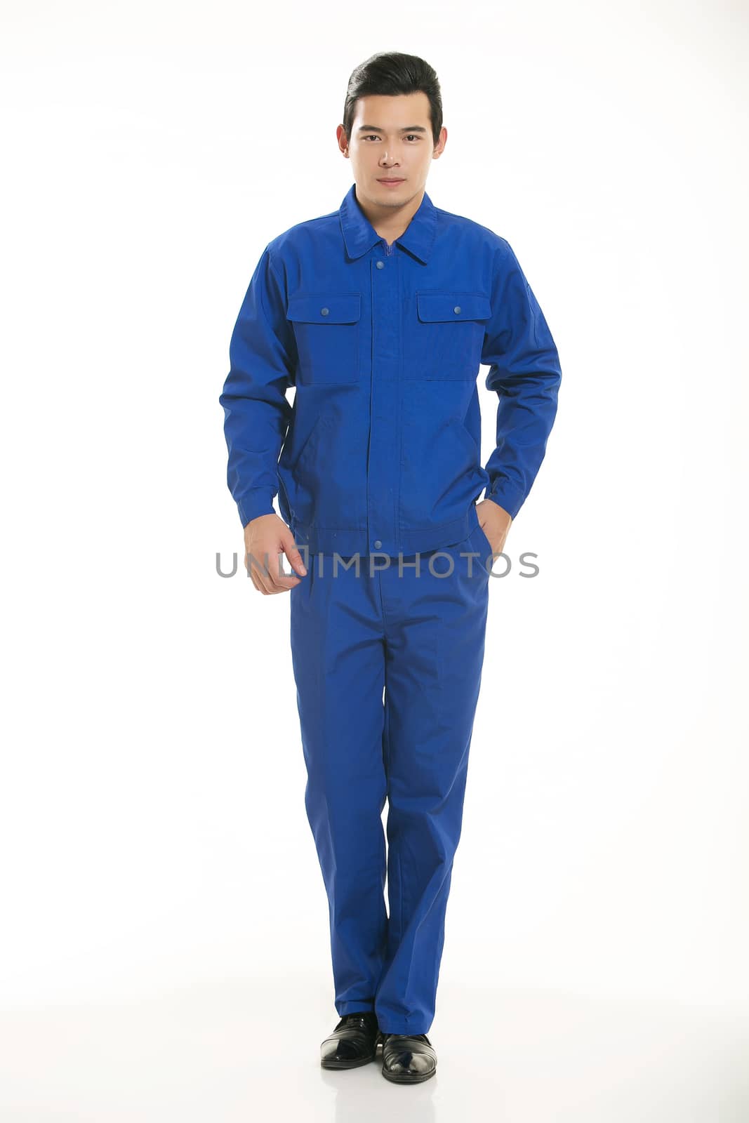 The young engineer various occupation clothing standing in front of a white background