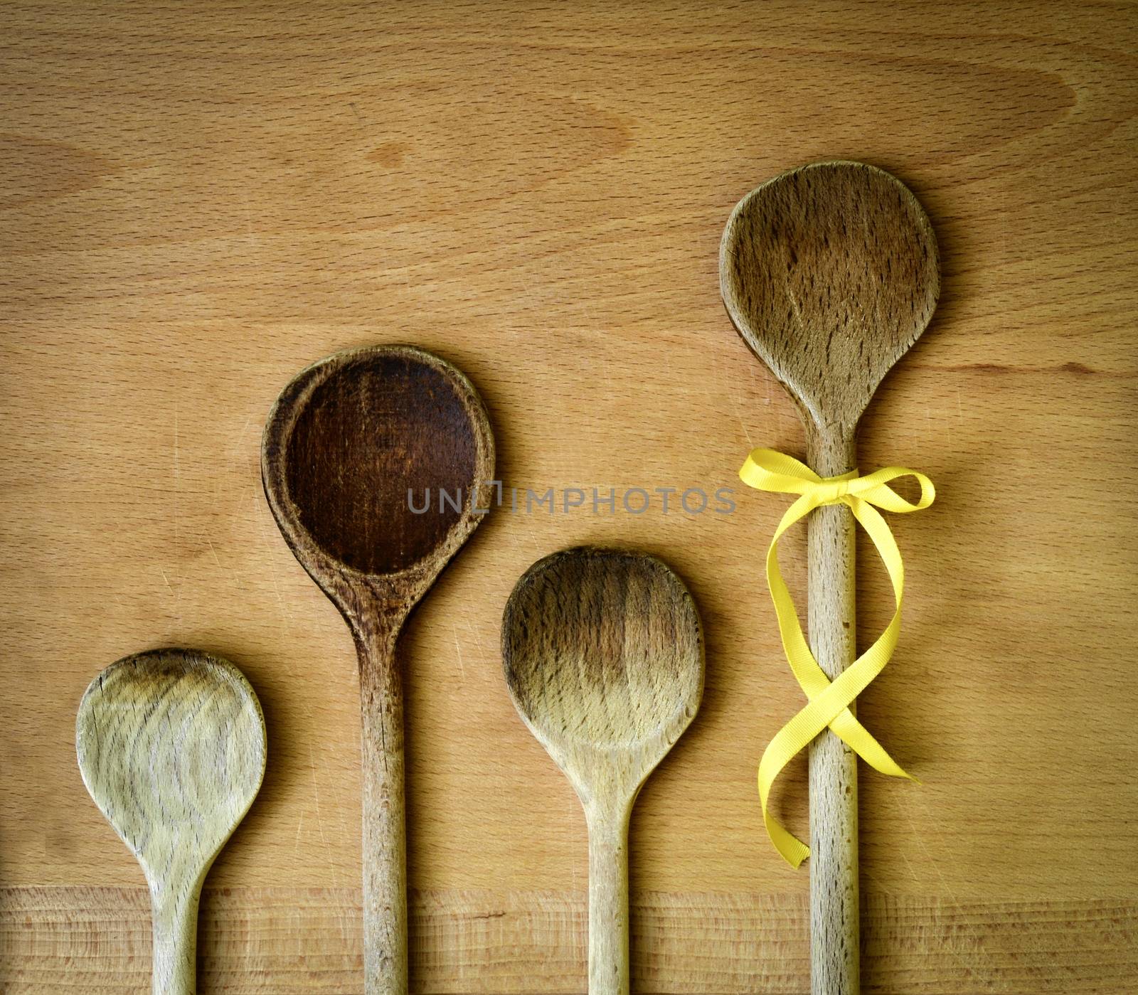 background spoons family with yellow ribbon bow