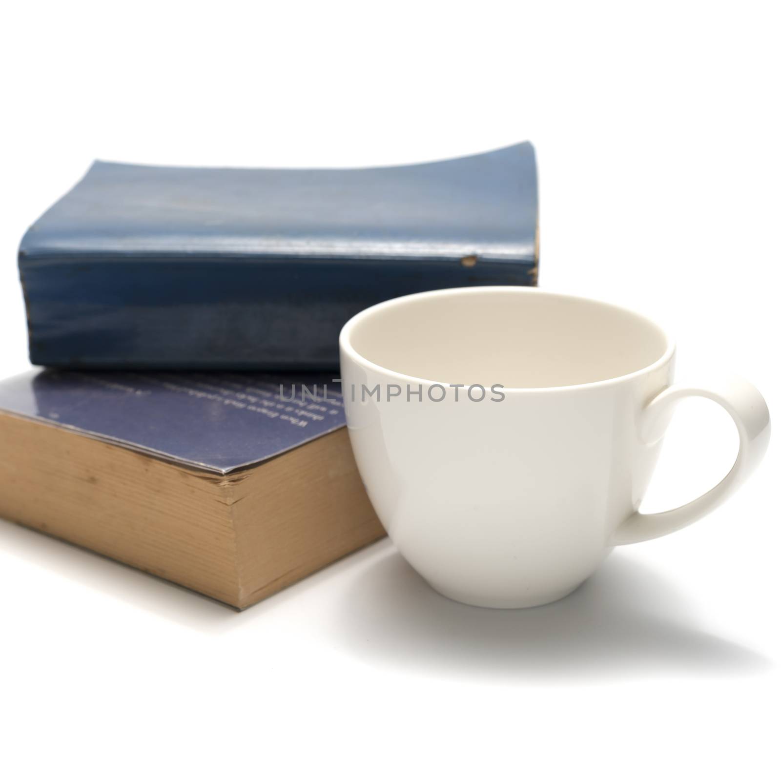stack of book and coffee cup isolated on white background