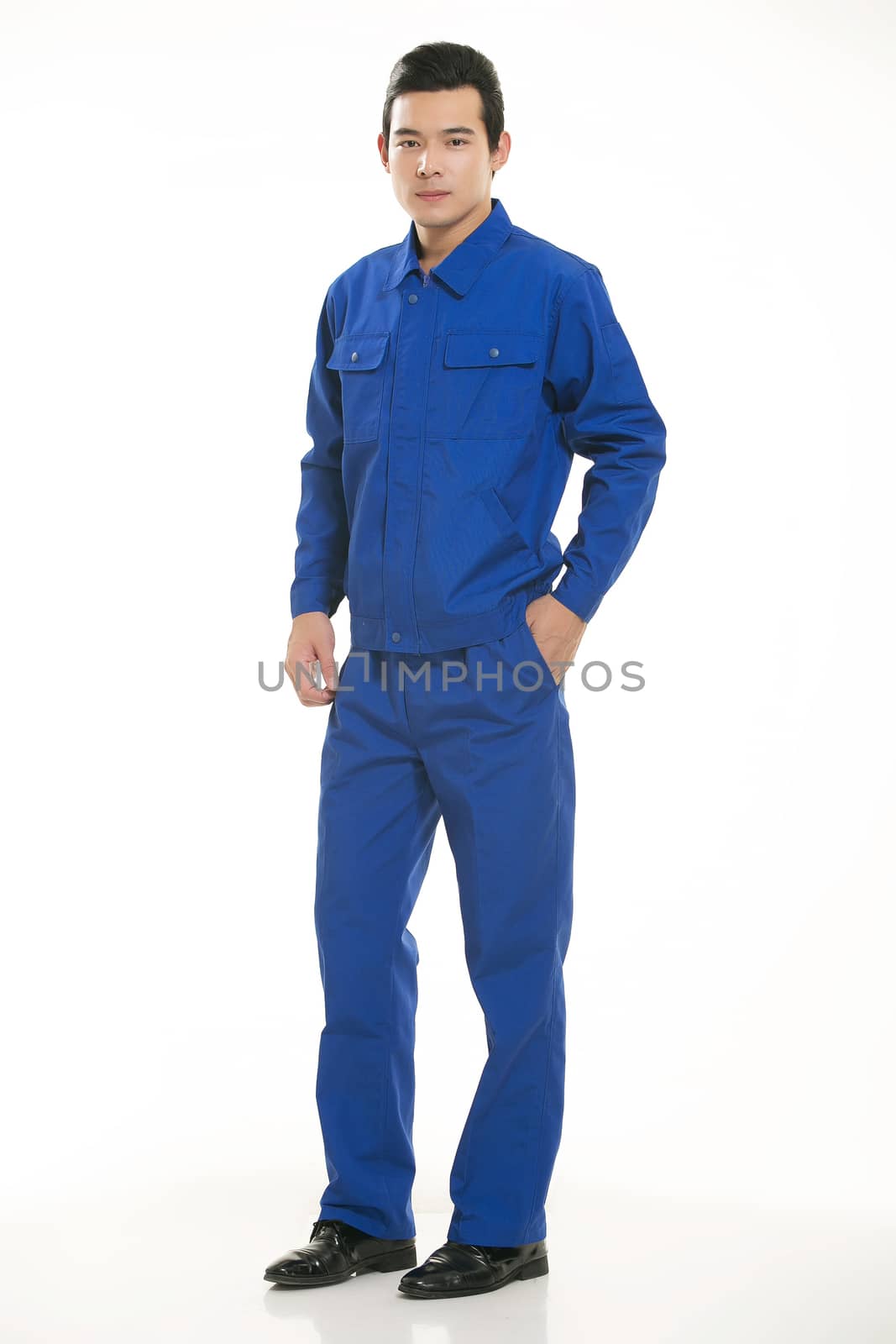 The young engineer various occupation clothing standing in front of a white background