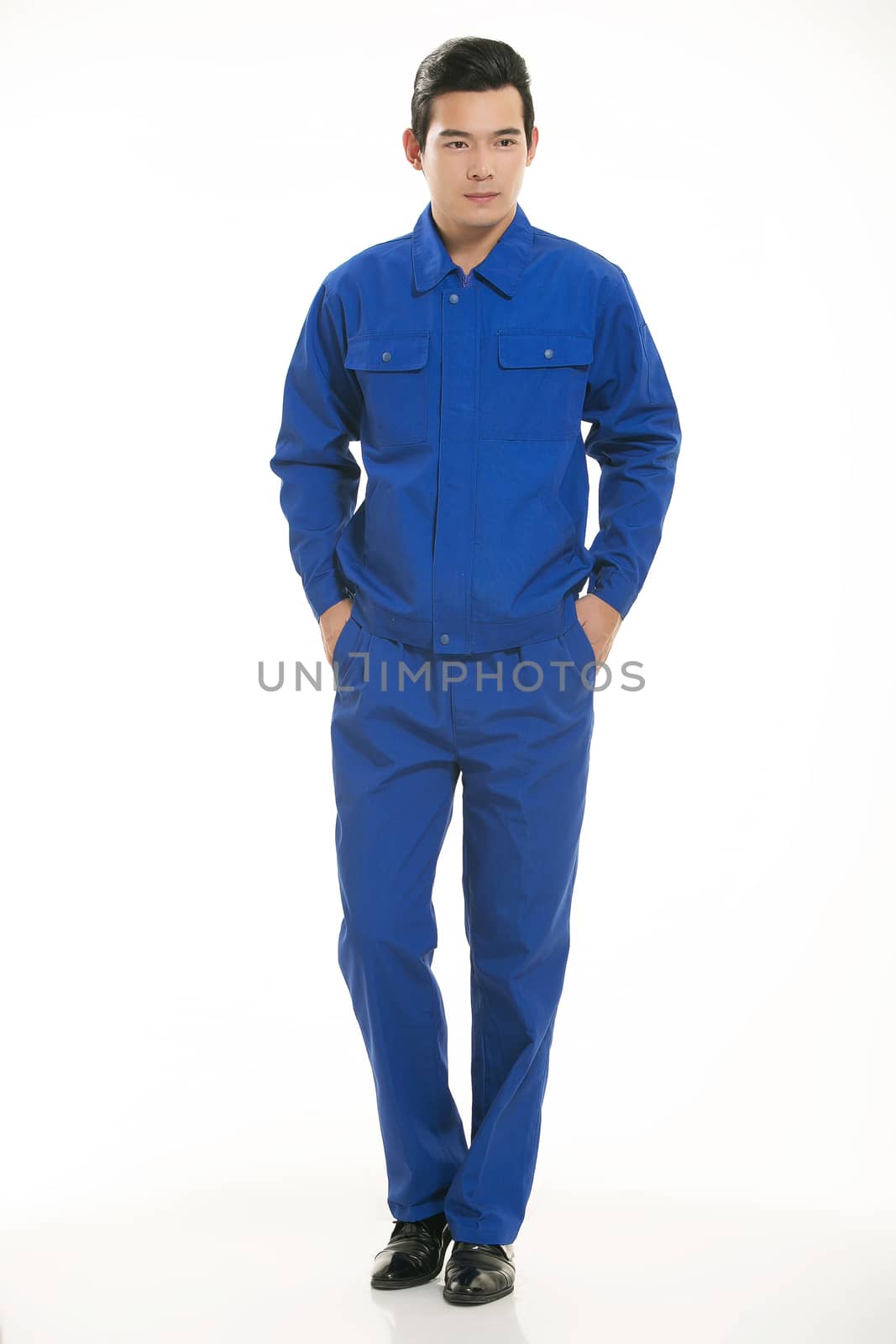 The young engineer various occupation clothing standing in front of a white background
