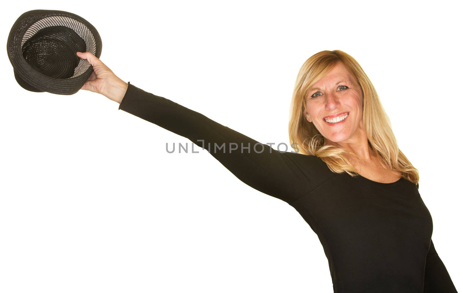 Cute female dancer holding out hat over white background