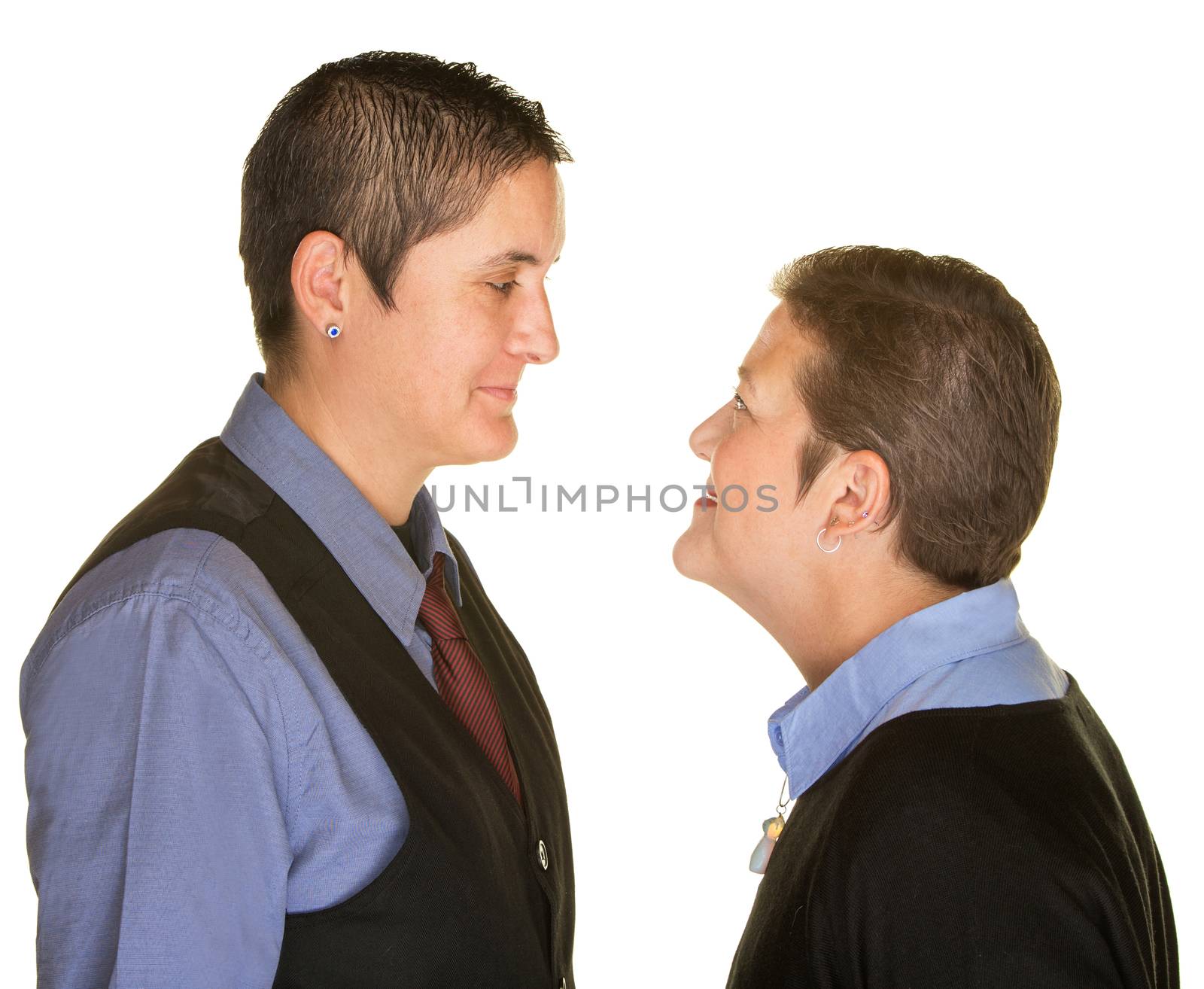 Isolated boyish female couple staring at each other