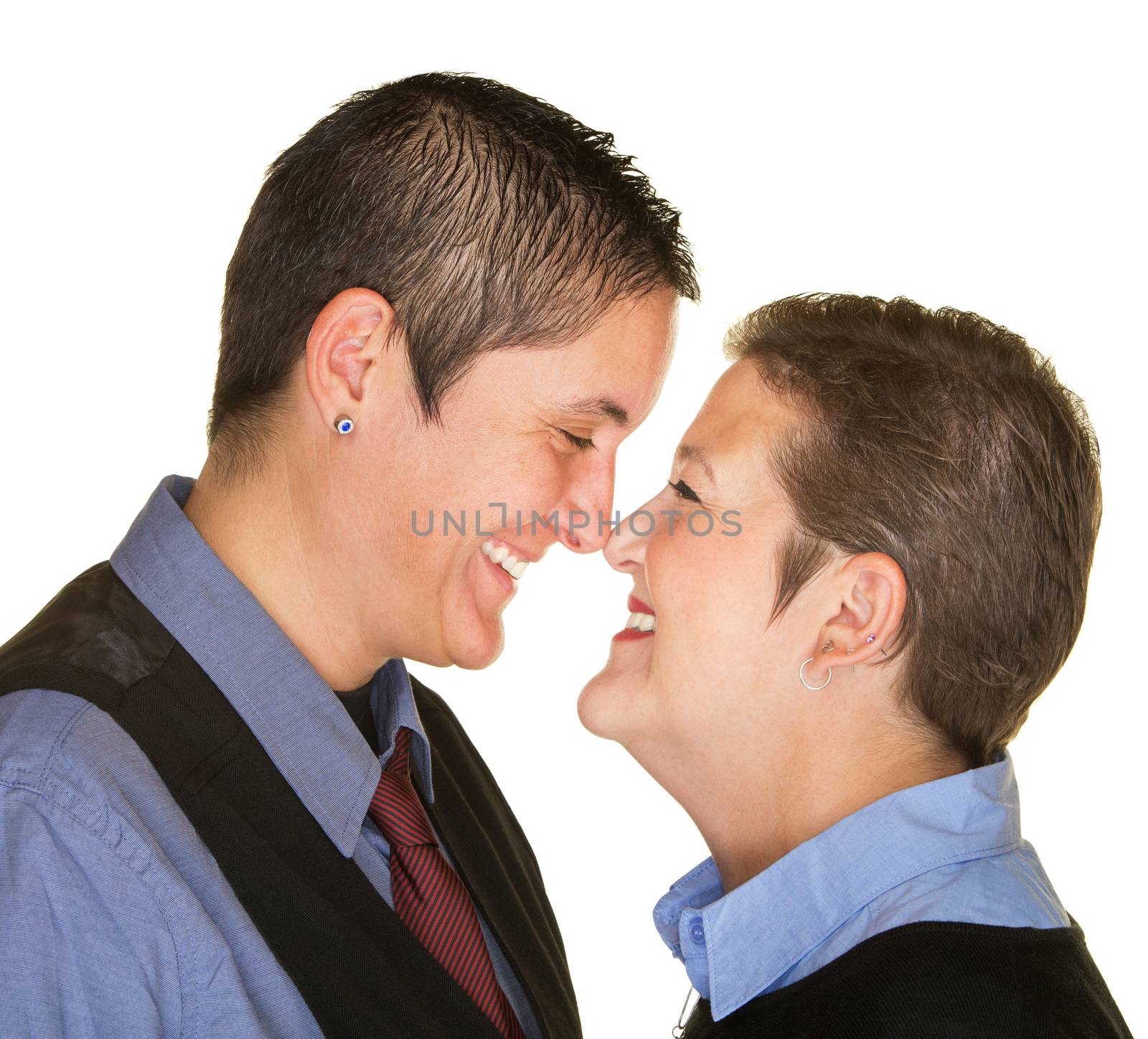 Happy lesbian couple touching noses over isolated background