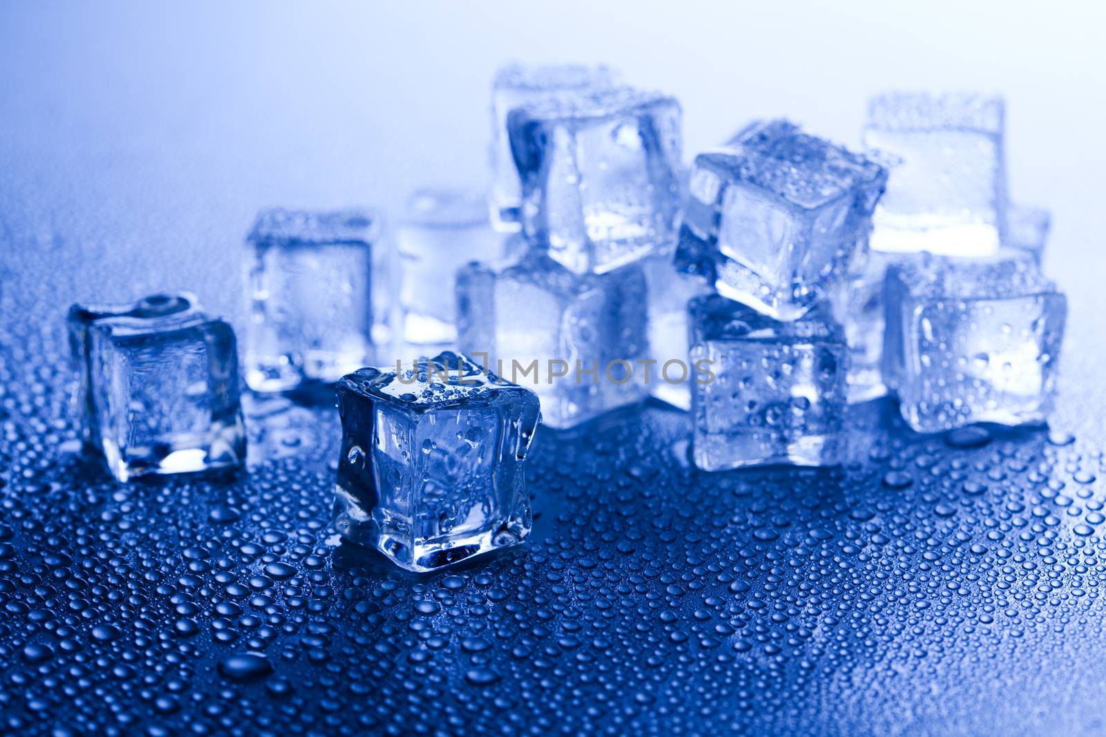 Ice cubes on blue background