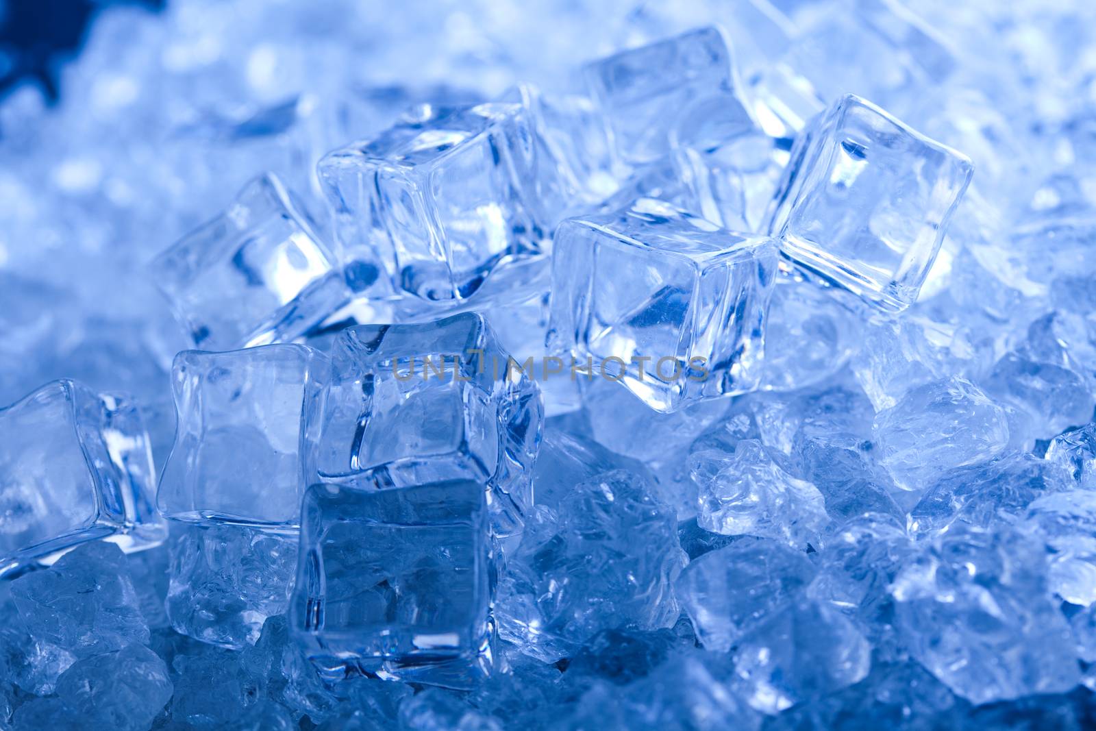 Ice cubes on blue background