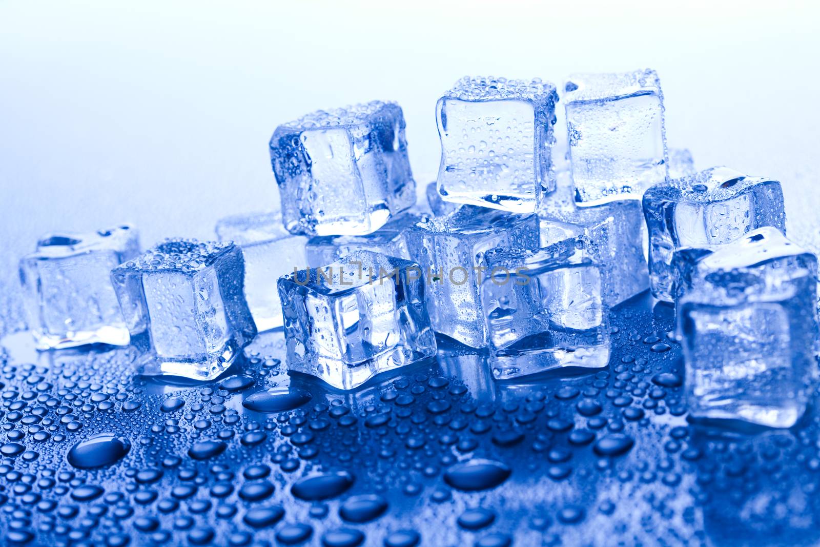 Ice cubes on blue background