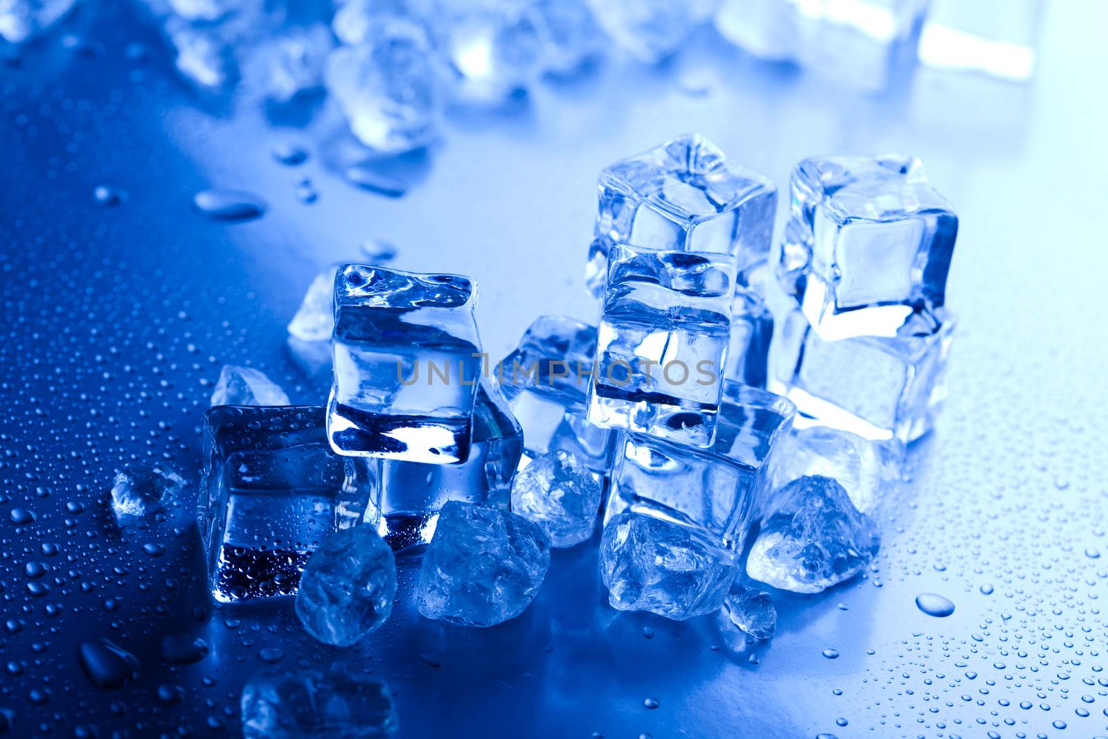 Ice cubes on blue background