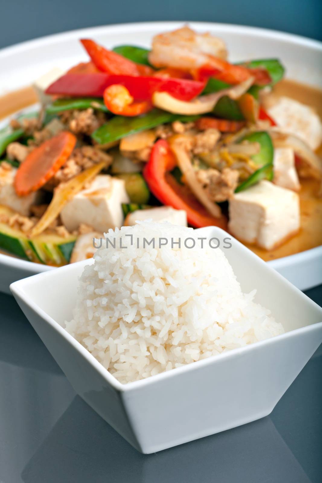 Fresh Thai food stir fry with tofu and white jasmine rice. 