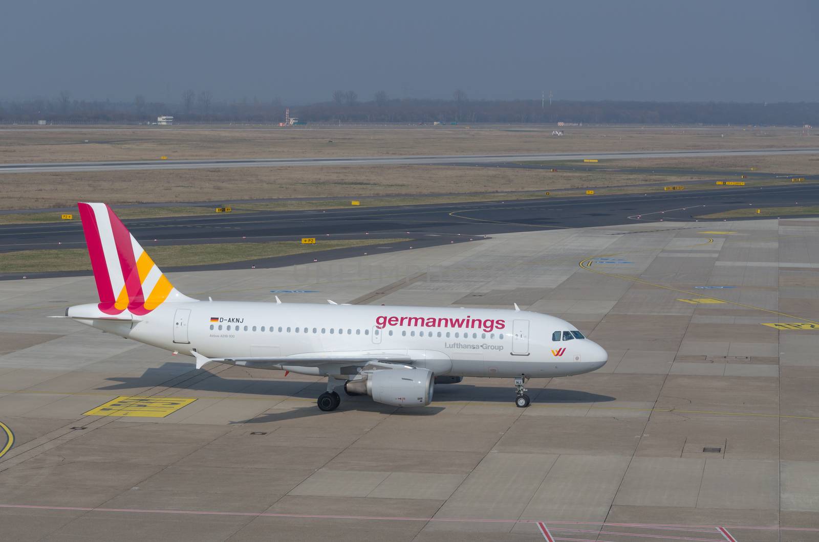 Dusseldorf, Nrw, Germany - March 18, 2015: German Wings Airbus A319 landing at the Dusseldorf airport. Drive  to the Terminal boarding passengers.