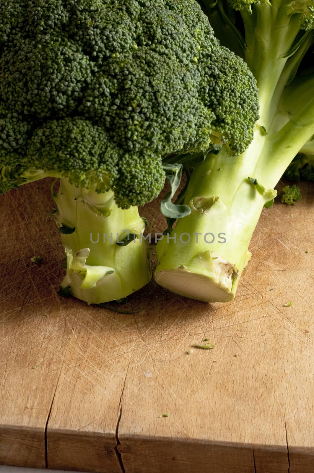 detail of a fresh broccoli on a wooden board