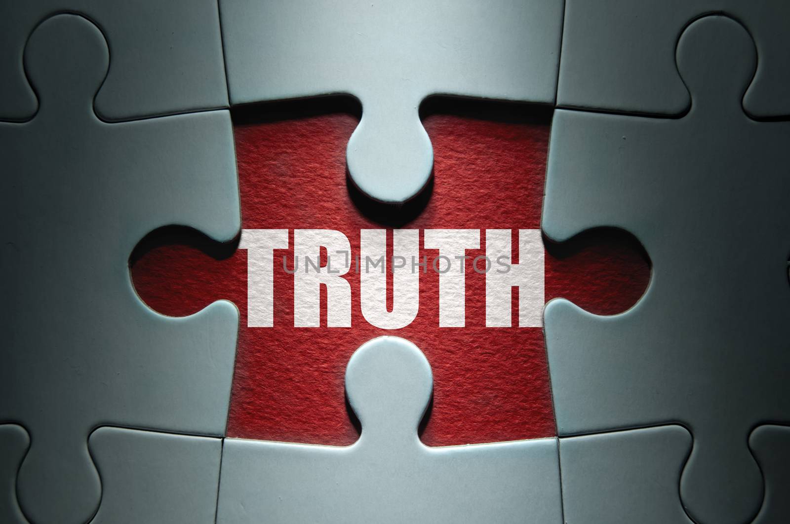 Missing piece from a jigsaw puzzle revealing the word truth