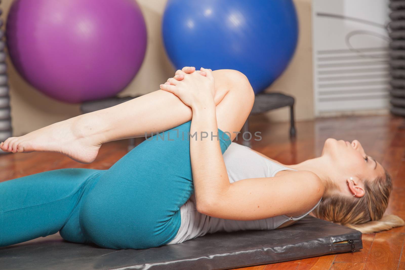 Woman stretching in yoga by ifilms