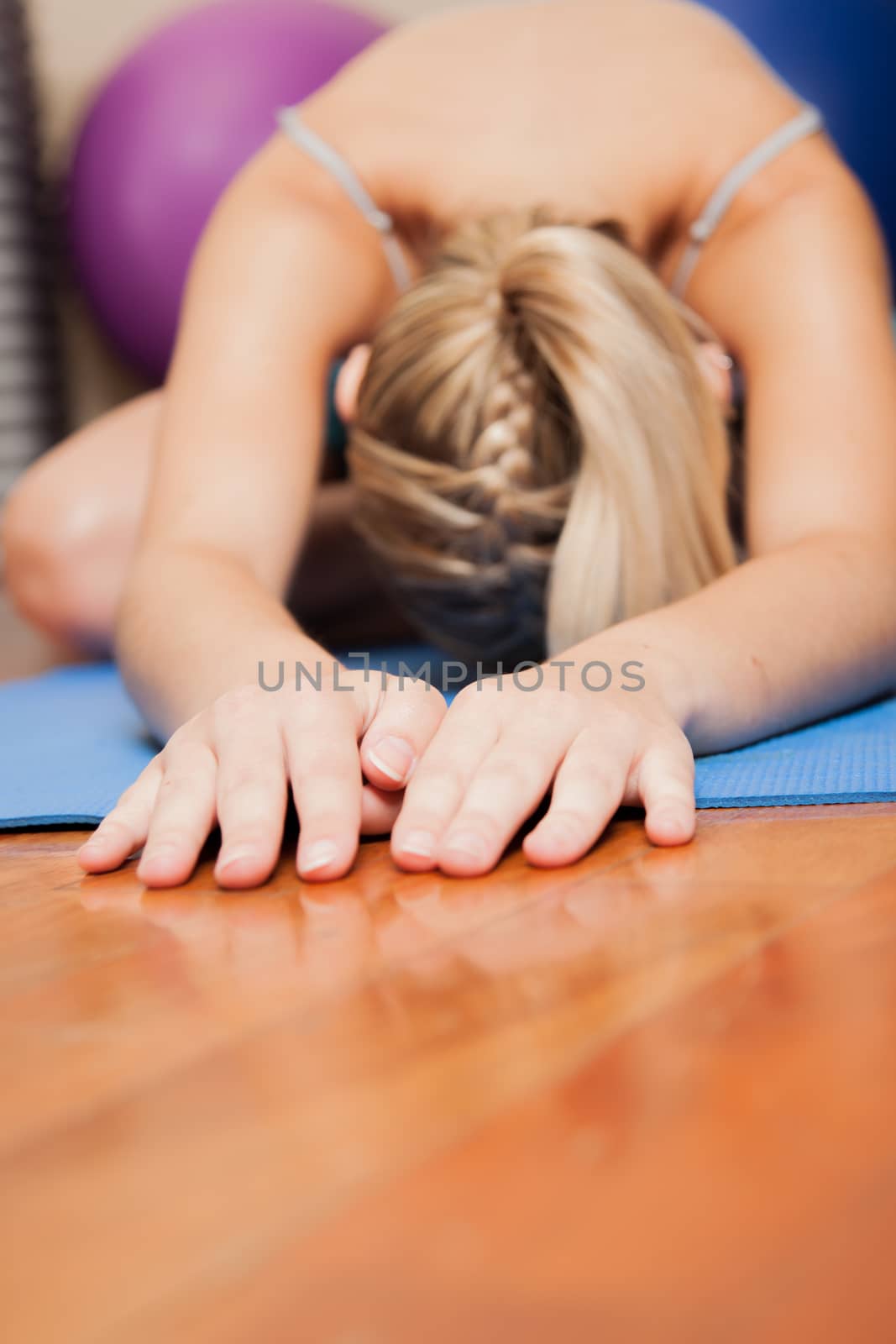 Woman stretching in yoga by ifilms