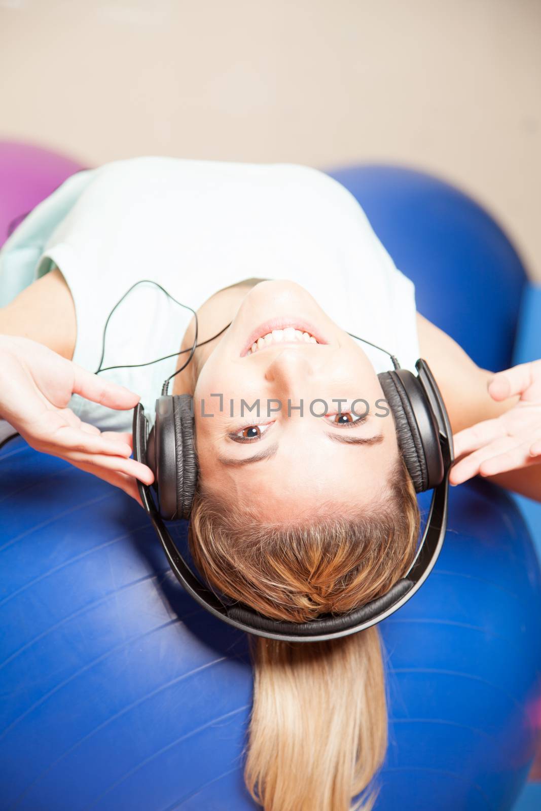 Woman listen to music in yoga class by ifilms