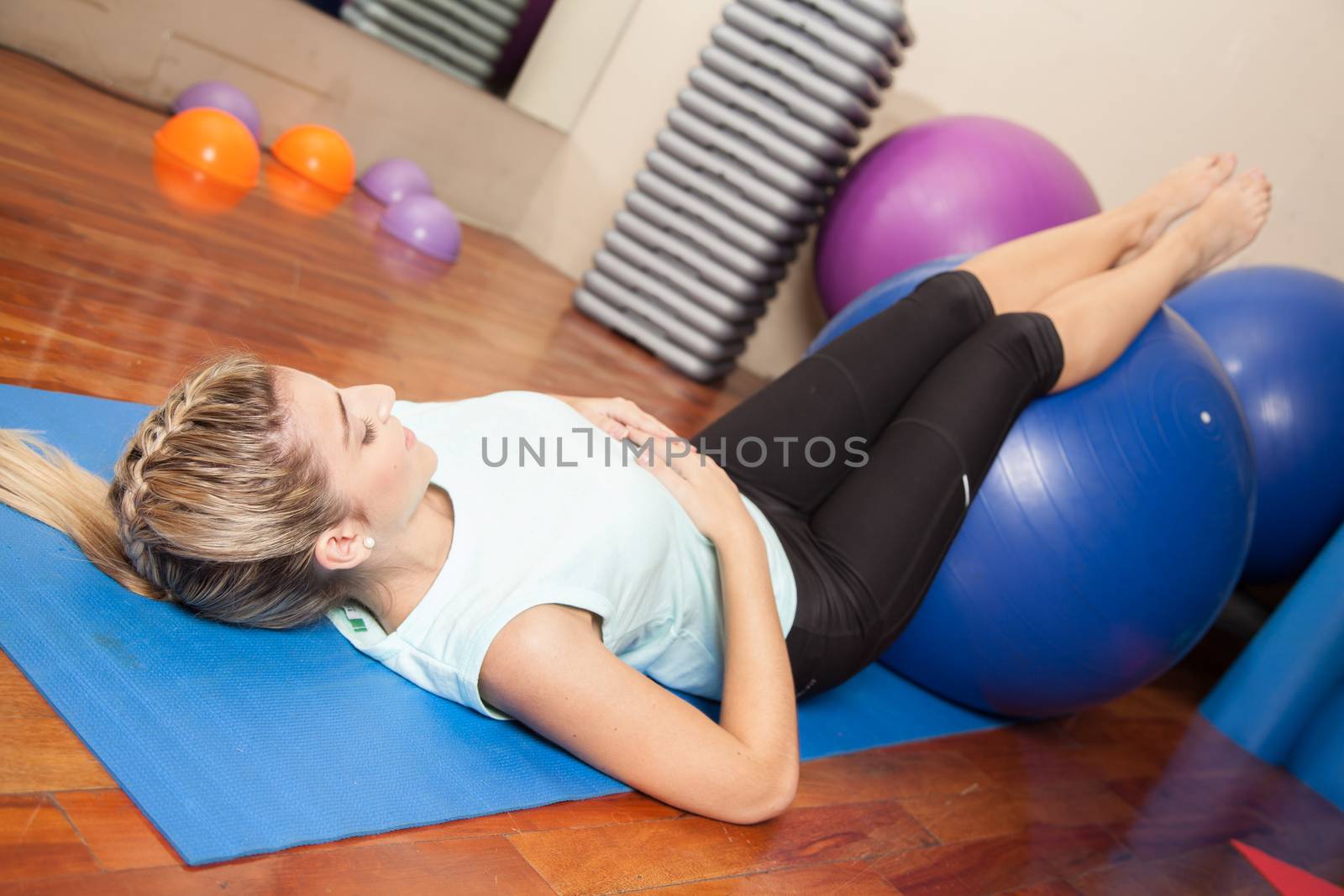 Woman stretching with a ball