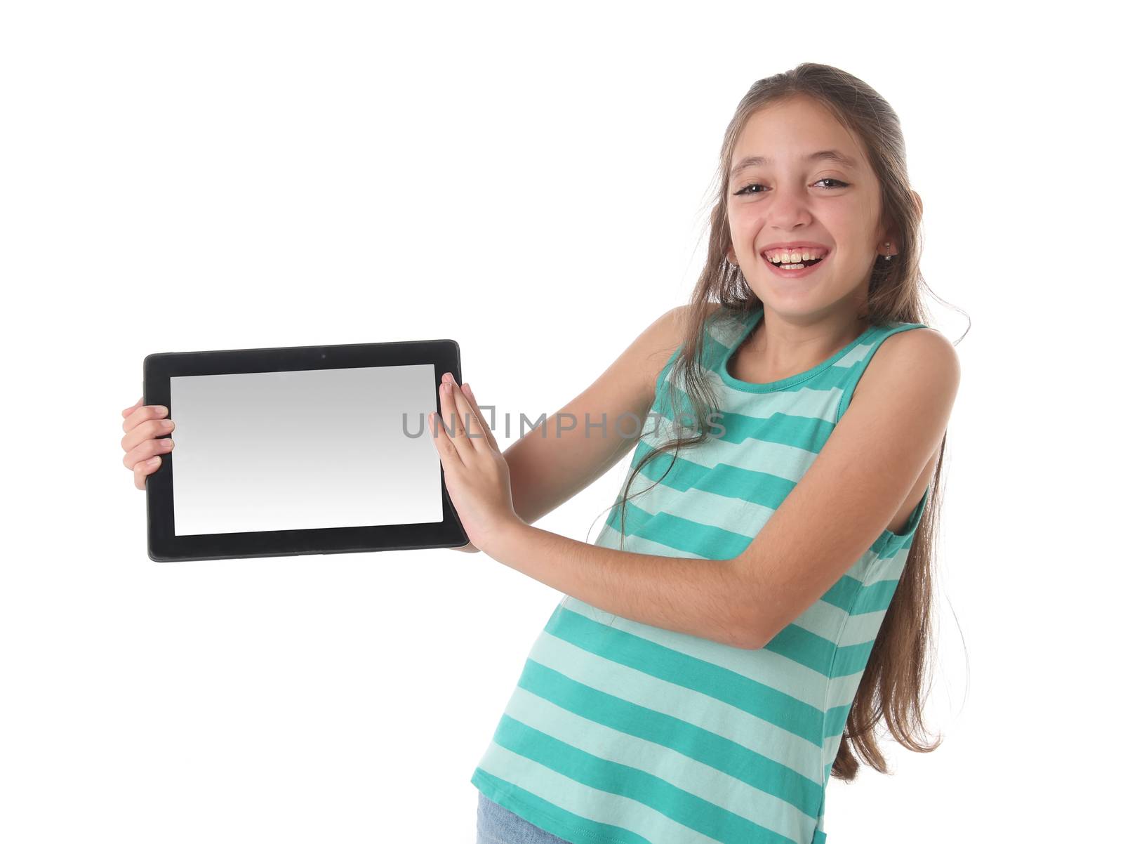 Beautiful pre-teen girl laughing with a tablet computer. Clipping path for the screen