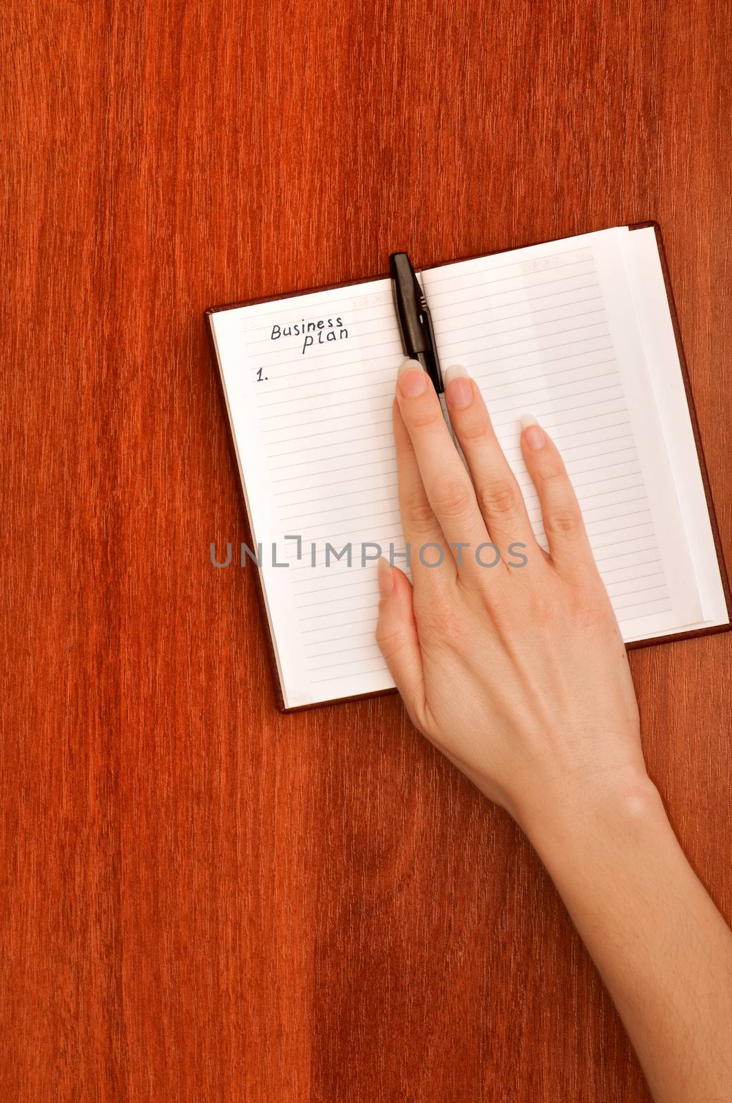 business woman create notes for business plan