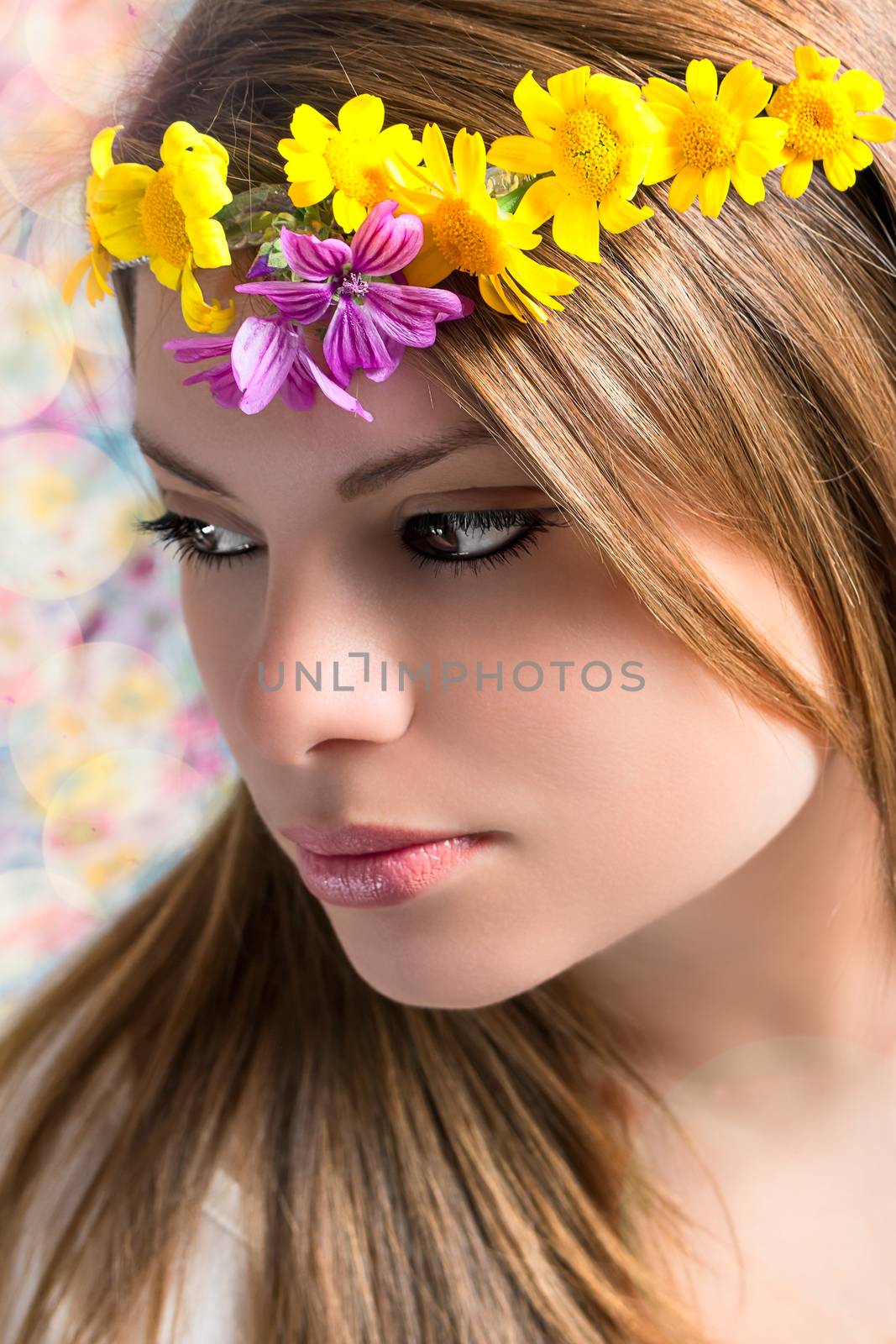 Girl with a garland of flowers on the head