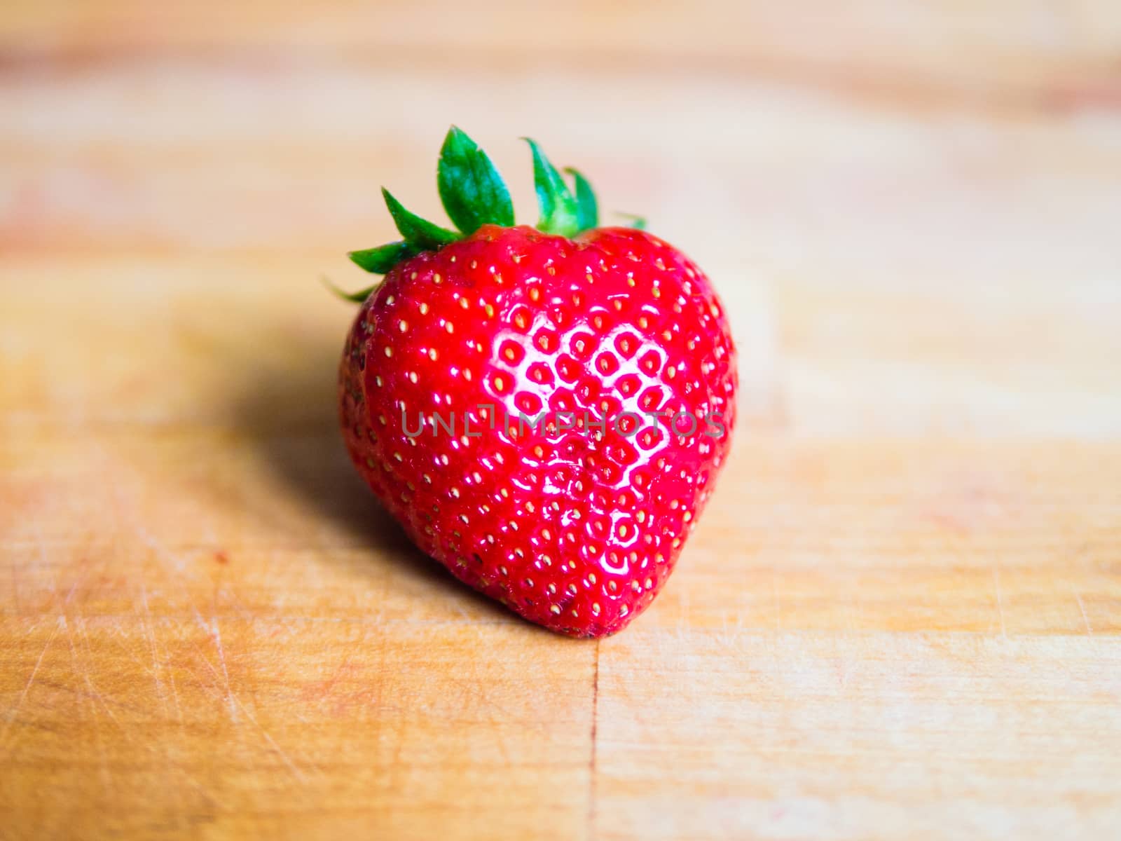 Fresh strawberry on a wooden board