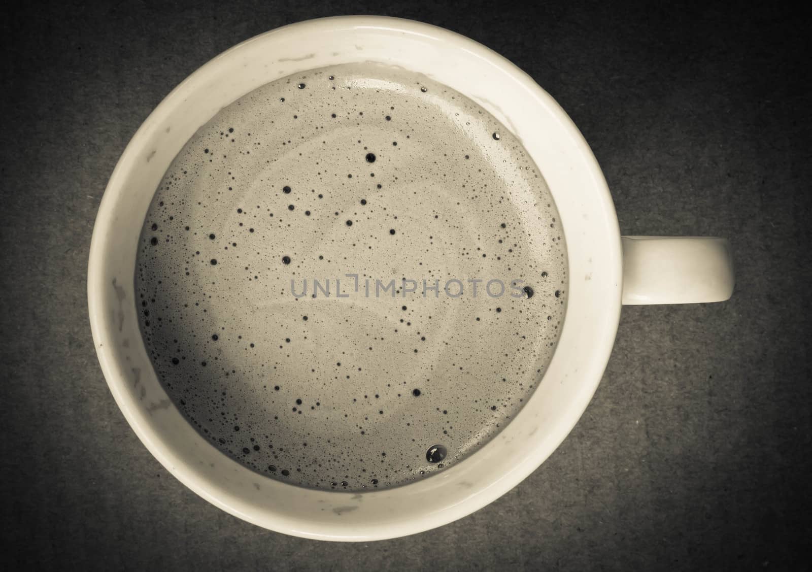 close up of coffee cup on white background