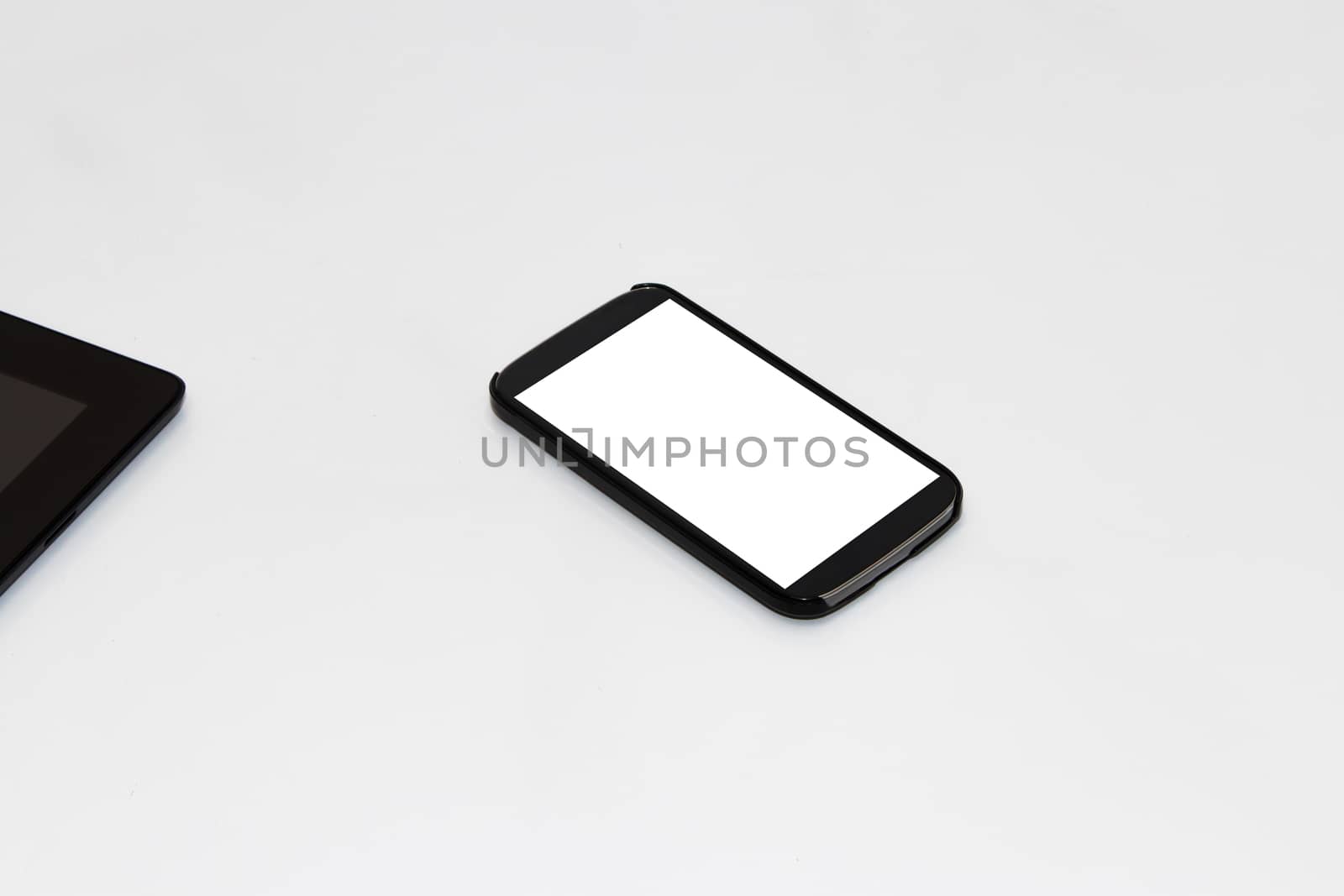 Close up view of mobile phone with blank white screen, isolated on white background.