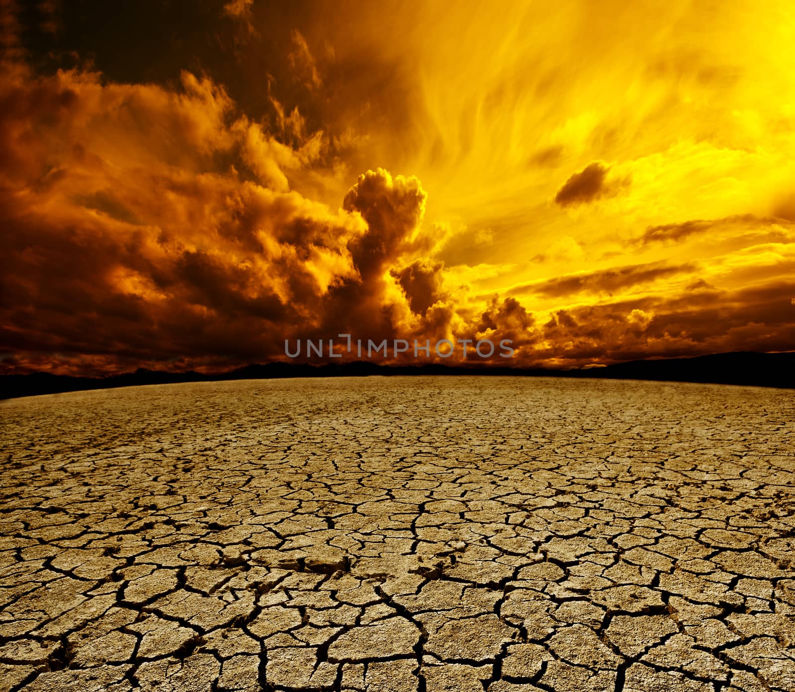 Desert and cloudy sky scenery. Dry soil and storm landscape