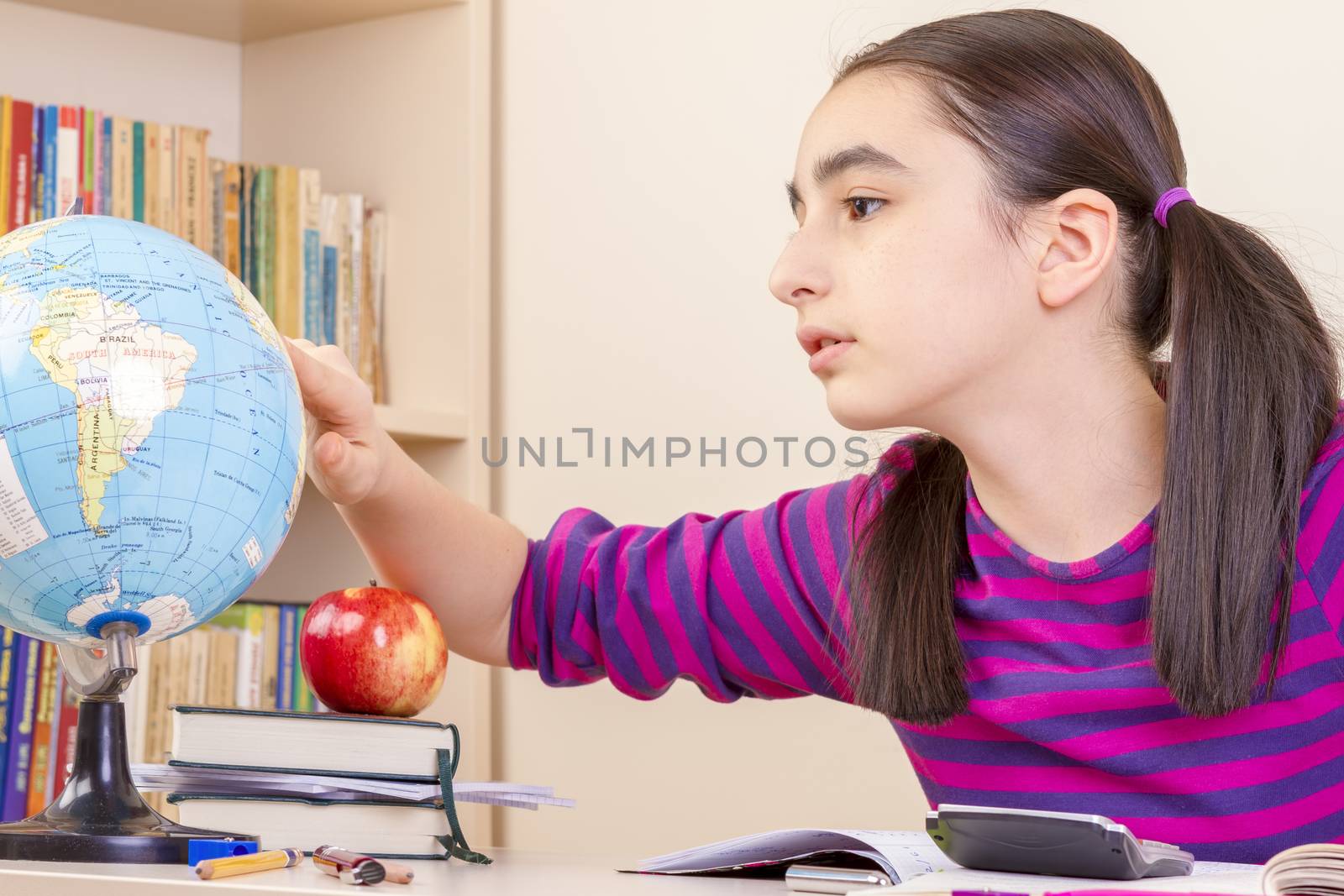 Schoolgirl learns geography by manaemedia