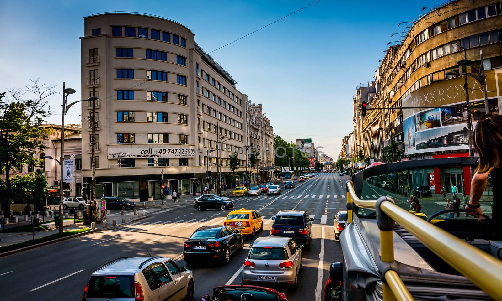 City bus touring on Magheru Boulevard, Bucharest, Romania.