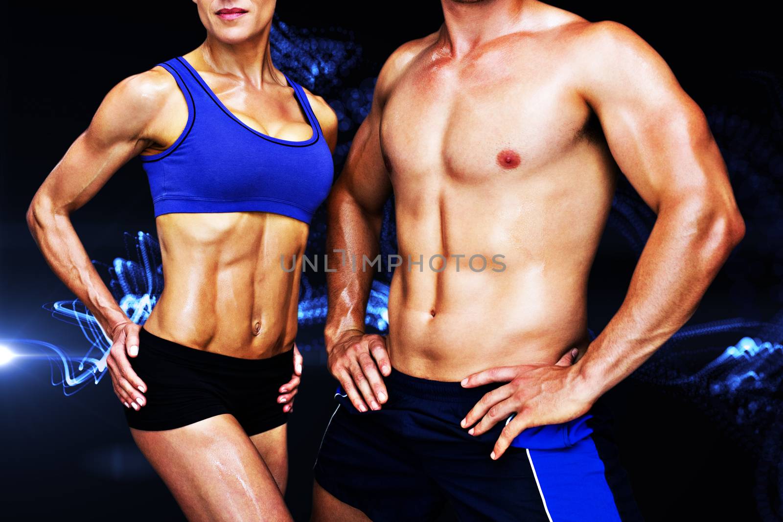 Bodybuilding couple against blue wave