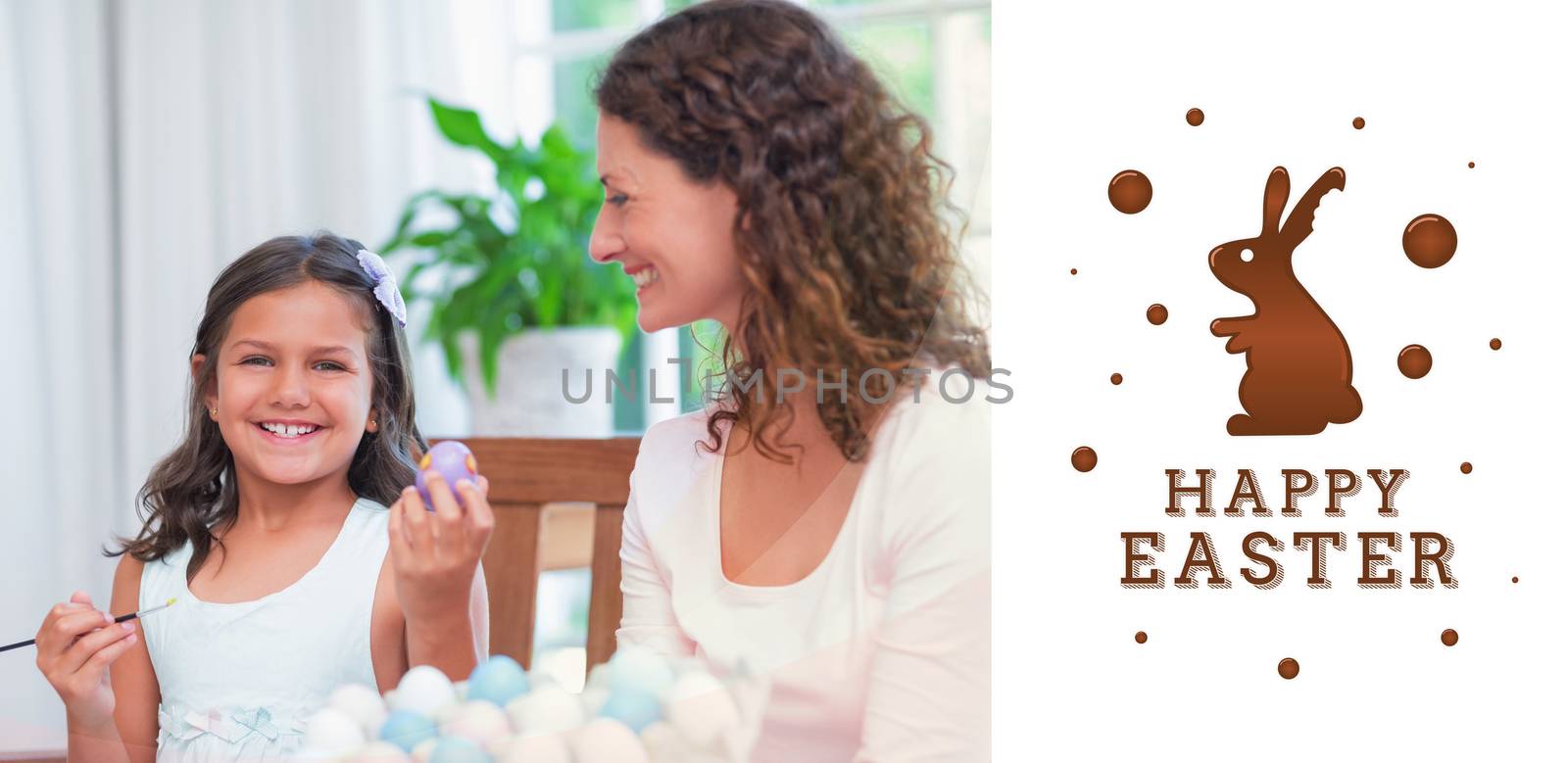 Composite image of happy mother and daughter painting easter eggs  by Wavebreakmedia