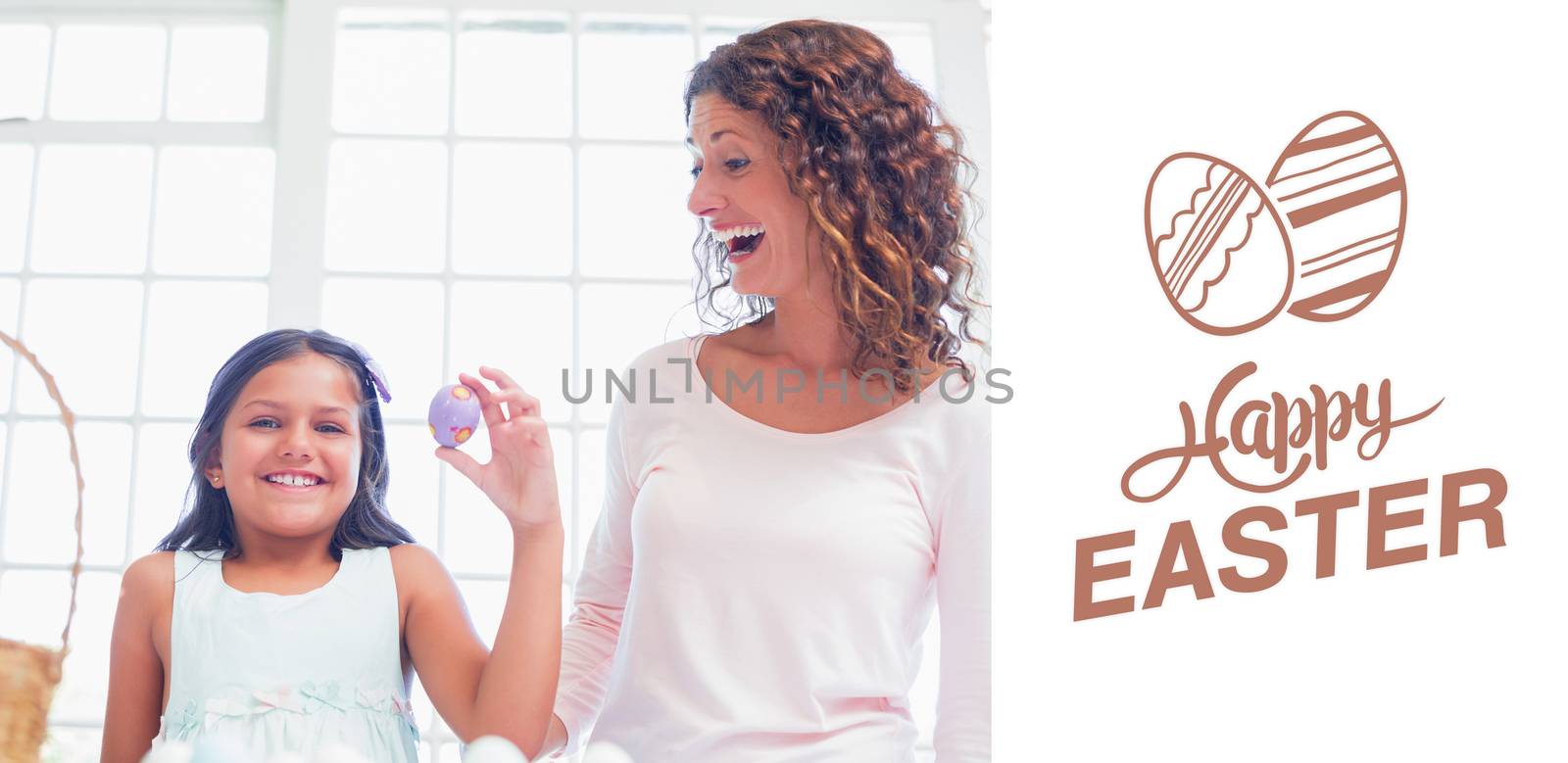 Happy girl holding easter egg  against happy easter graphic