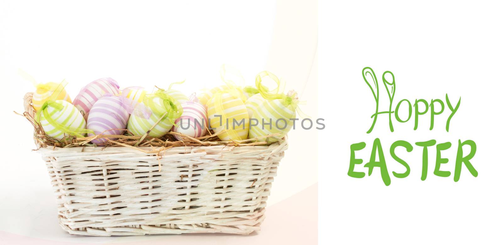 happy easter graphic against many easter eggs in basket