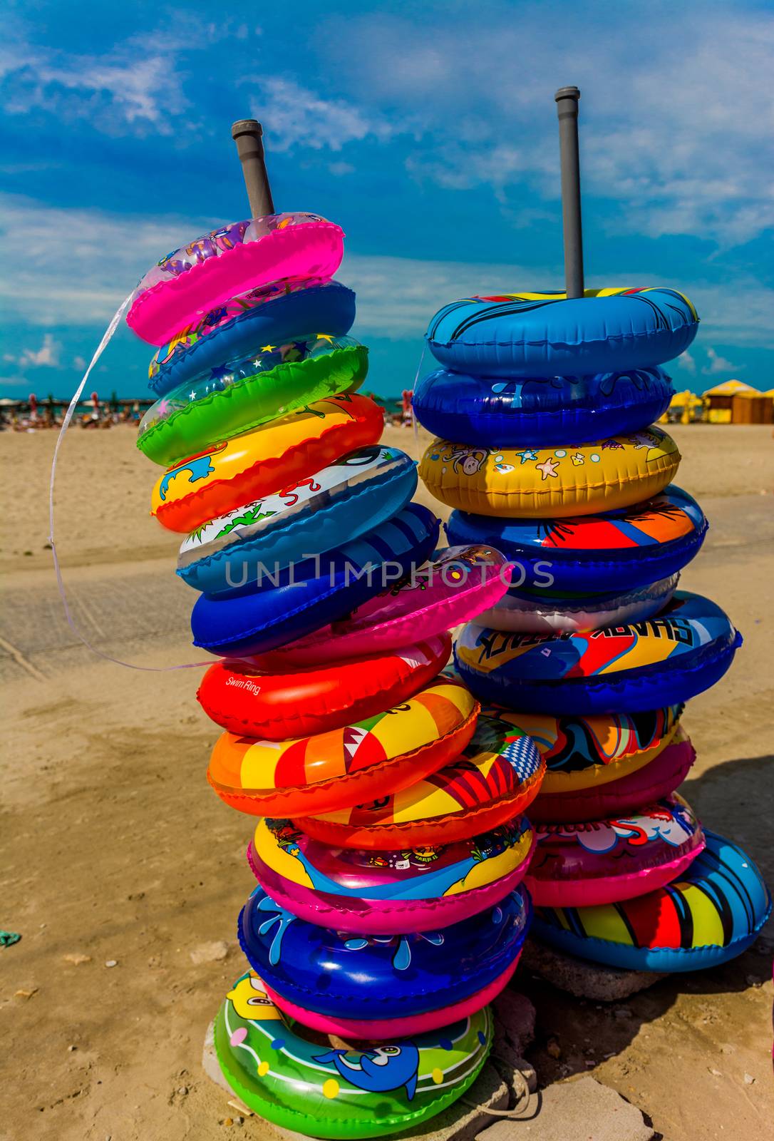 Colorful swimming buoys on the beach
